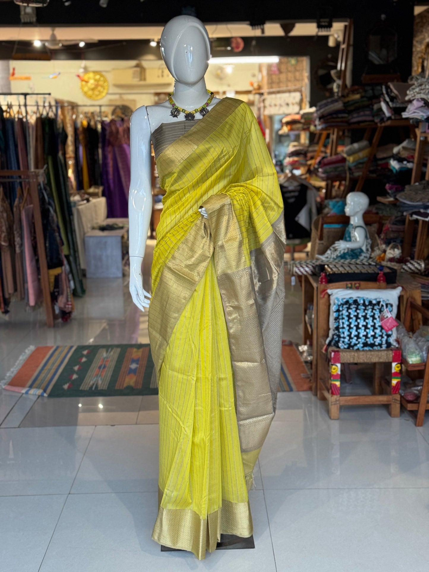 Yellow silk cotton Maheshwari handloom saree with zari pallu and vertical stripes all over