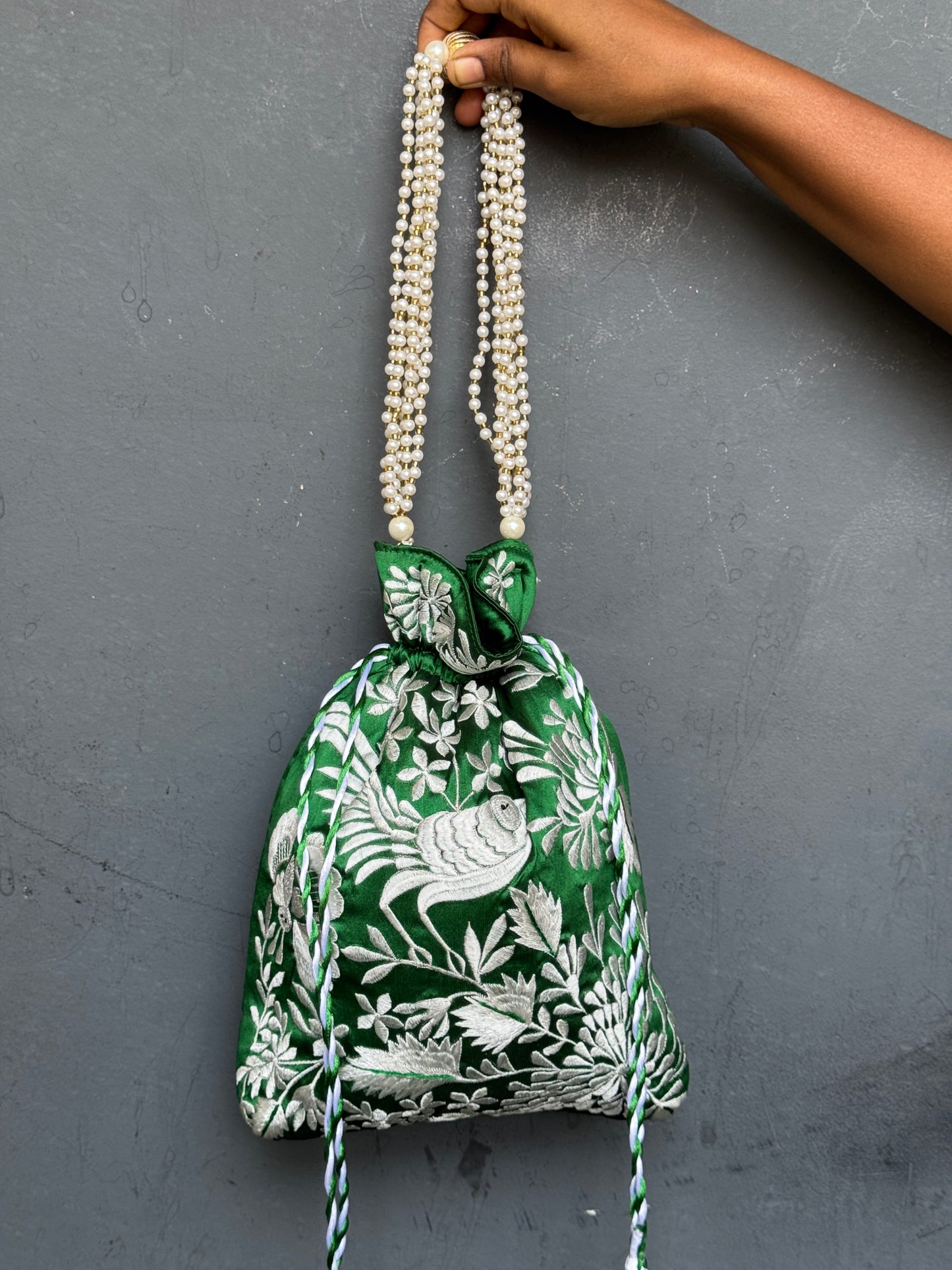 Parsi work party wear potlis with machine embroidery on art silk and pearl chain handle