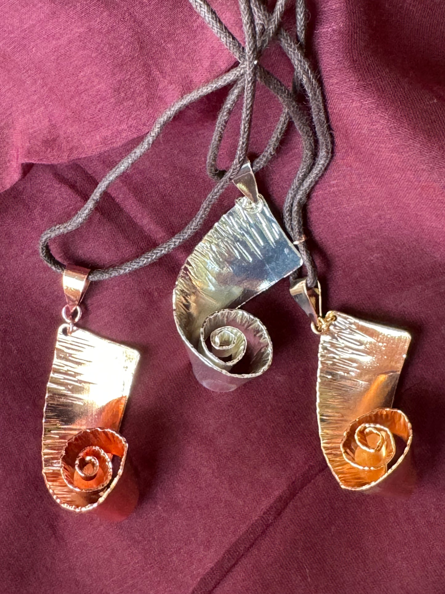 Vakratunda, twisted elephant trunk handcrafted copper pendant with brown thread