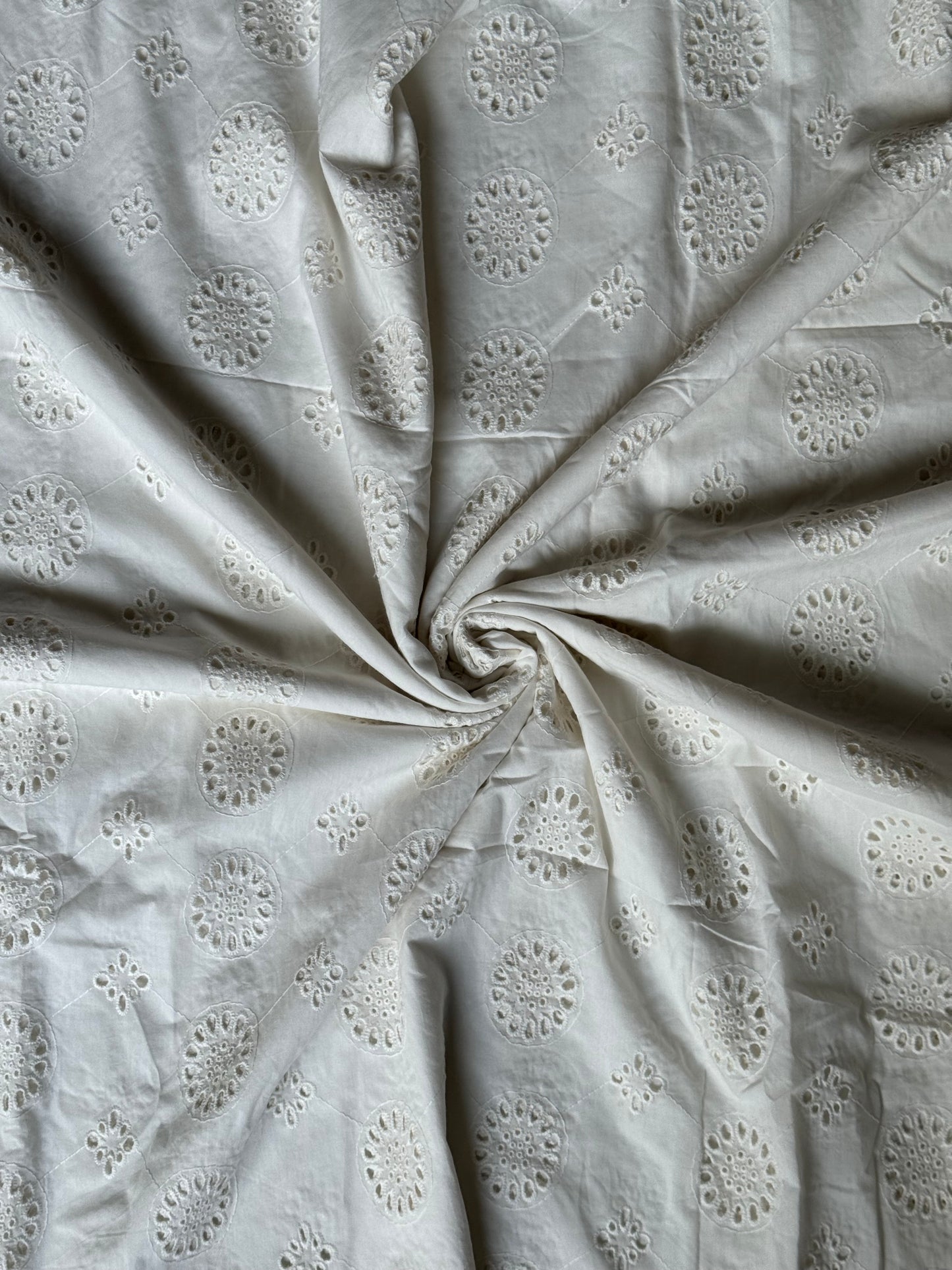 Off white schiffli cut work cotton fabric