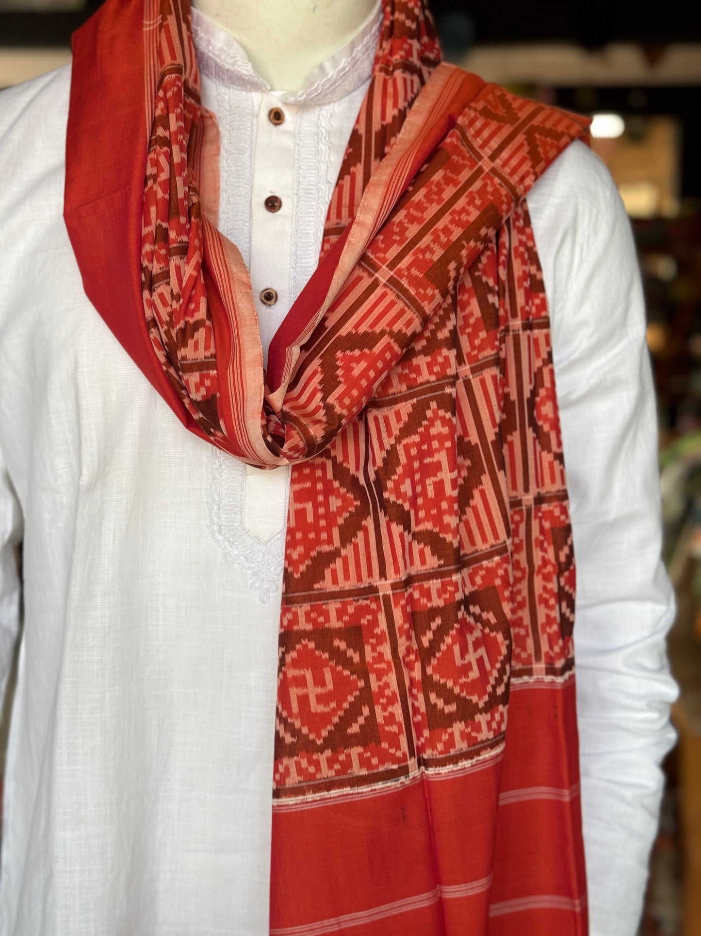 Rust tone cotton handloom soft unisex ikat stole with Swastik motifs