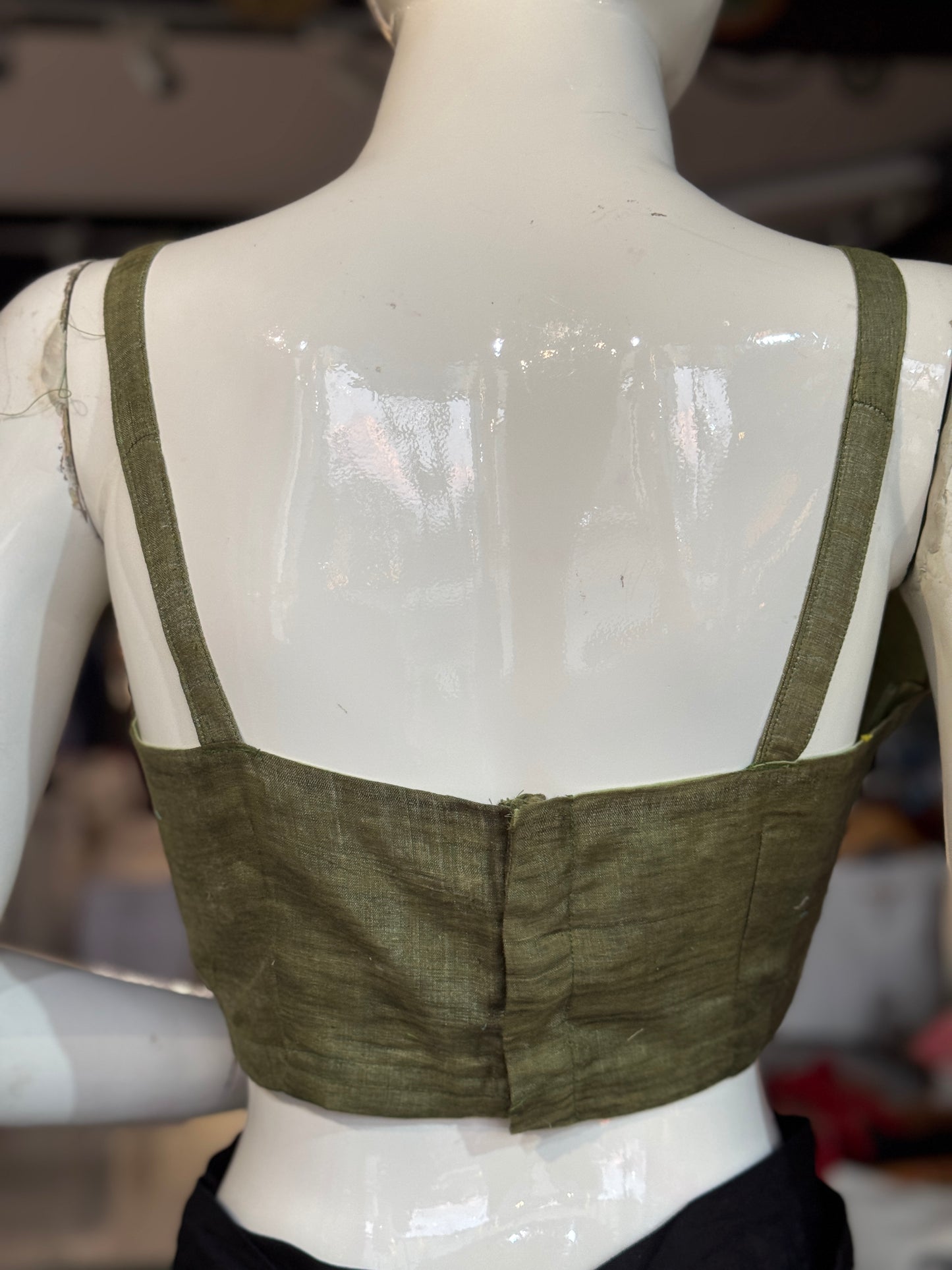 Green silk blouse with strap sleeves and front gathers