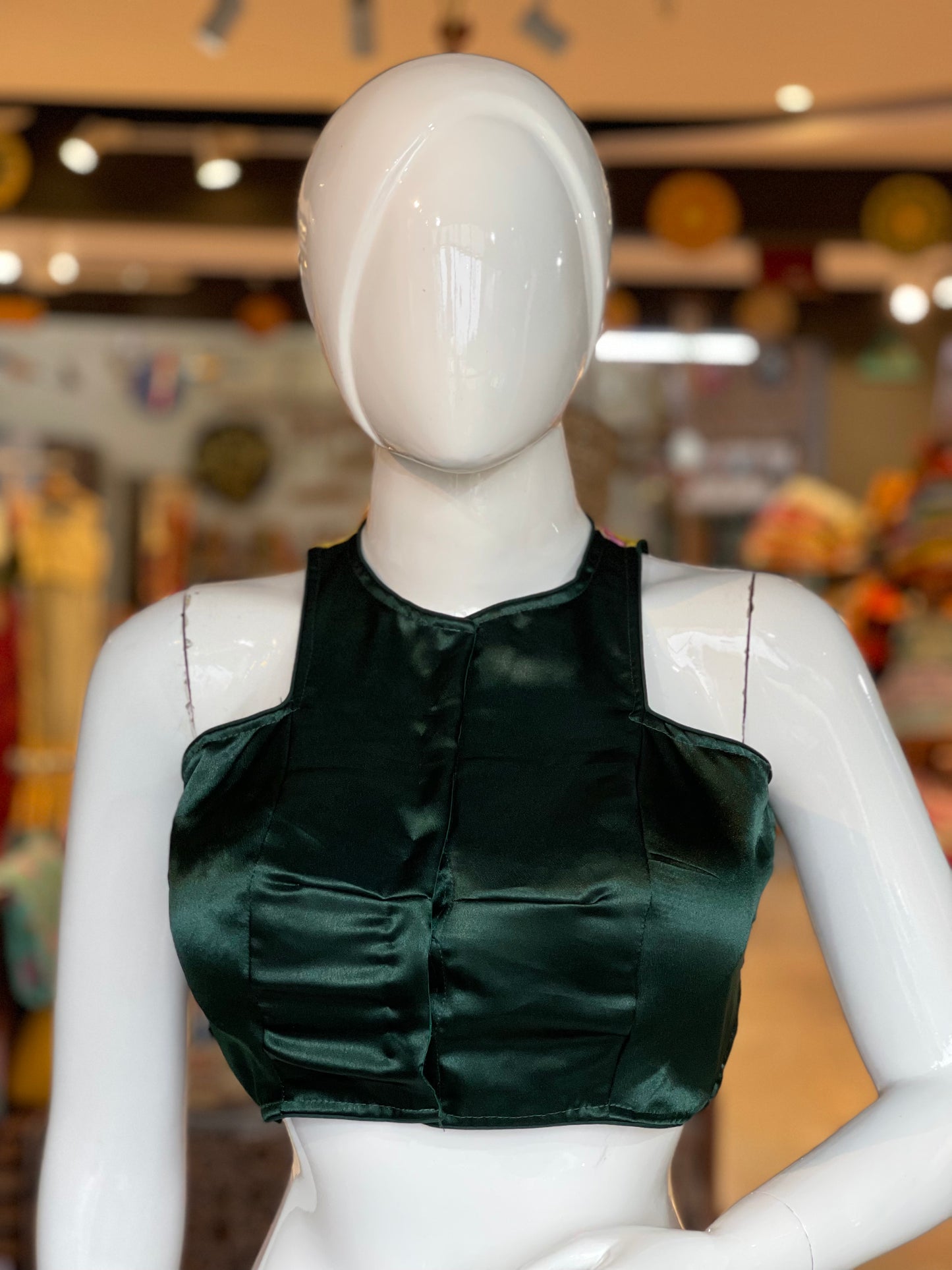Green halter neck satin blouse with embroidered yellow back patch