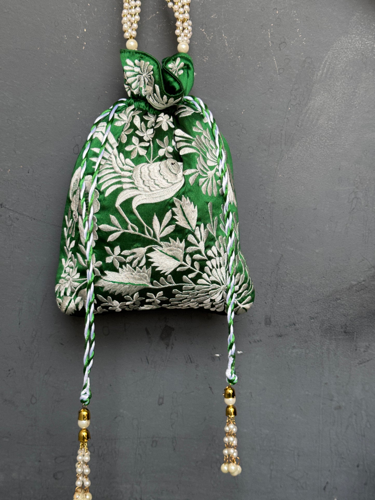 Parsi work party wear potlis with machine embroidery on art silk and pearl chain handle