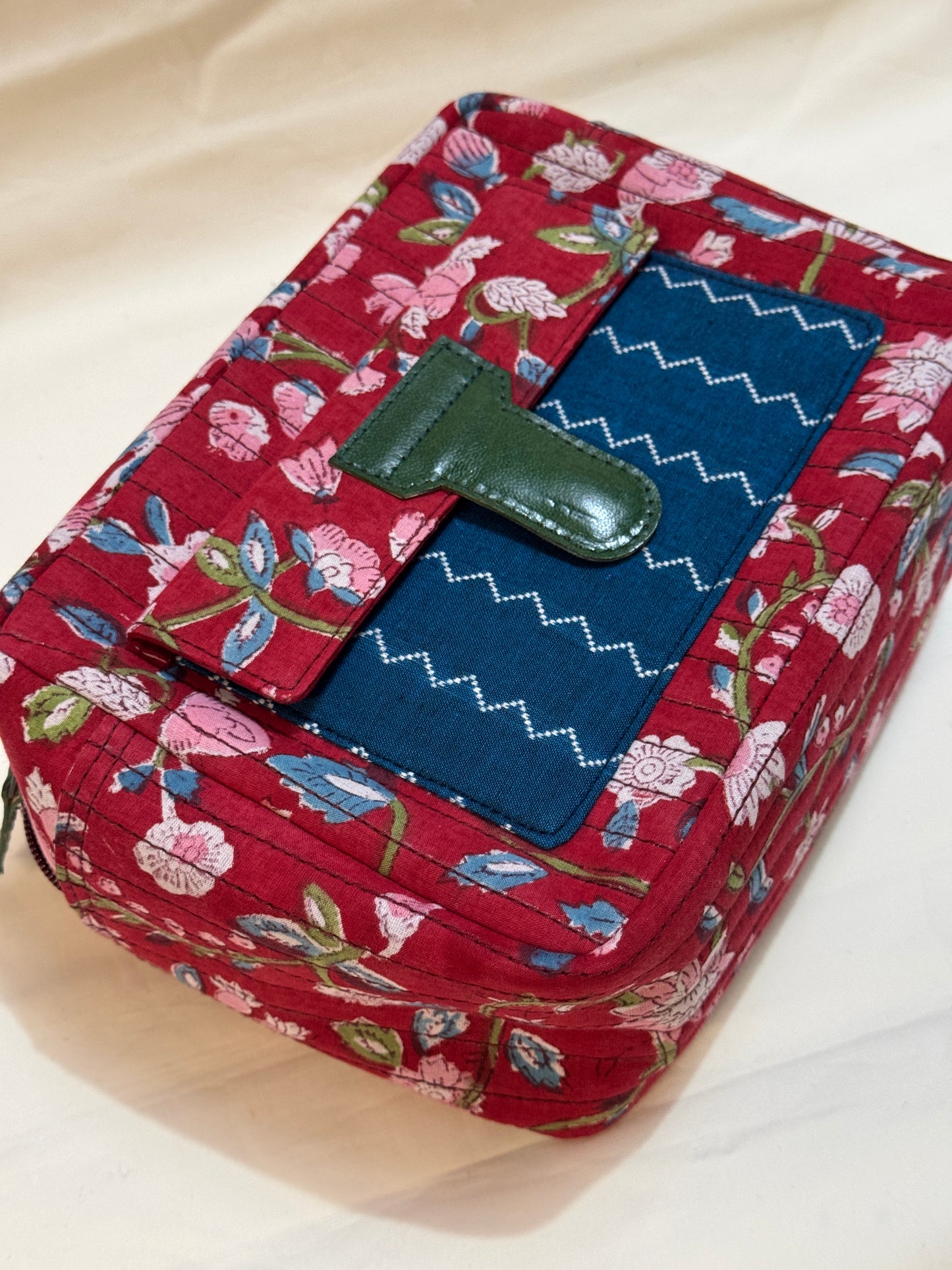 Handcrafted toiletries / travel pouch with leak proof plastic lining plus colorful front pocket with leather patch