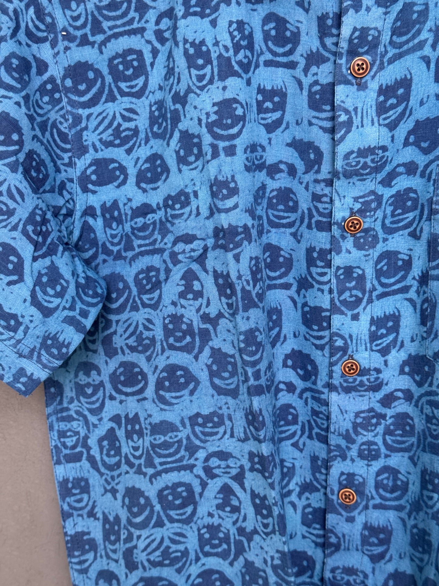 Blue quirky faces print half sleeves mens screen printed cotton shirt