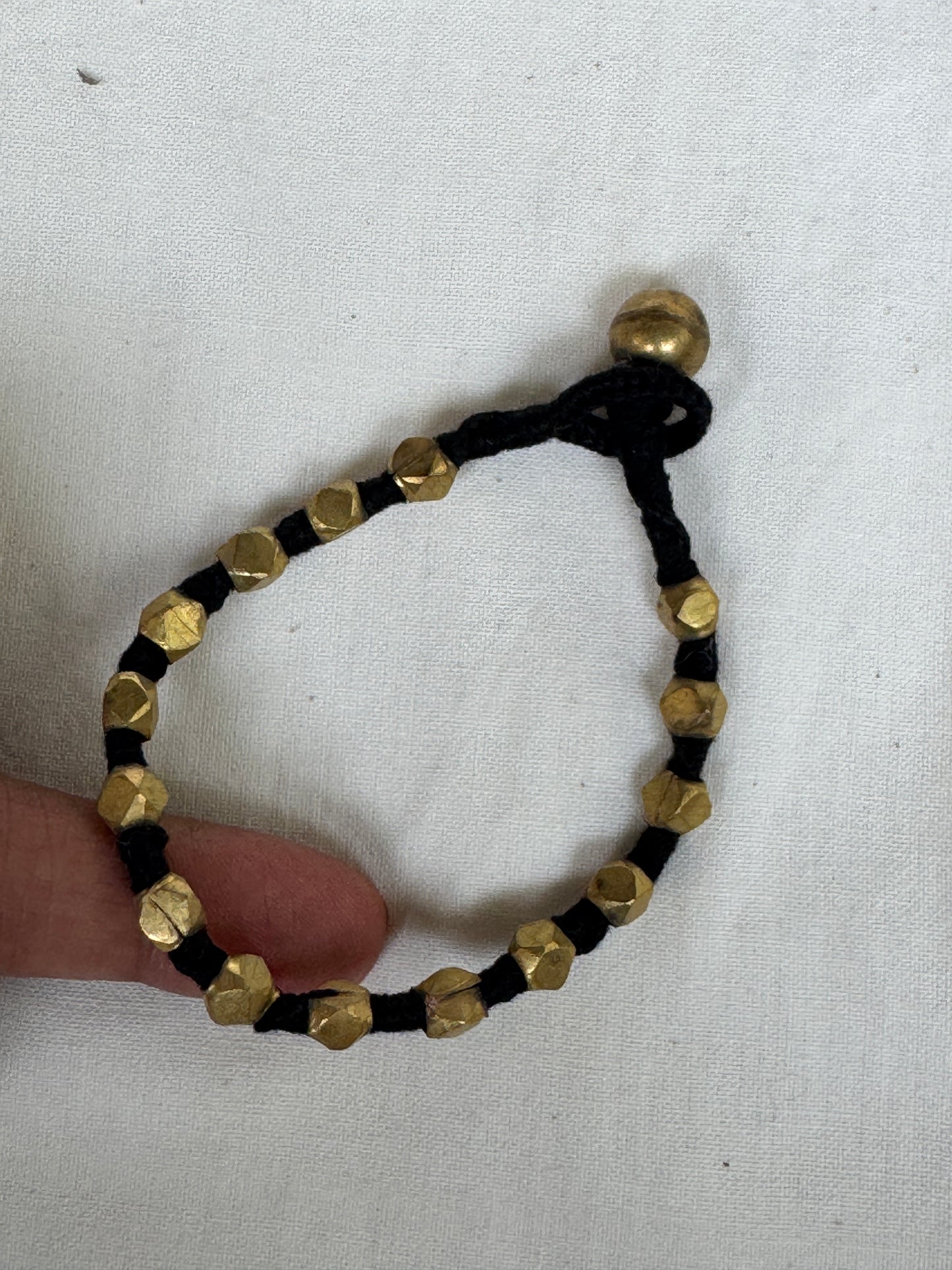 Nazariya bracelet - brass dokra handcrafted beads with black thread - single