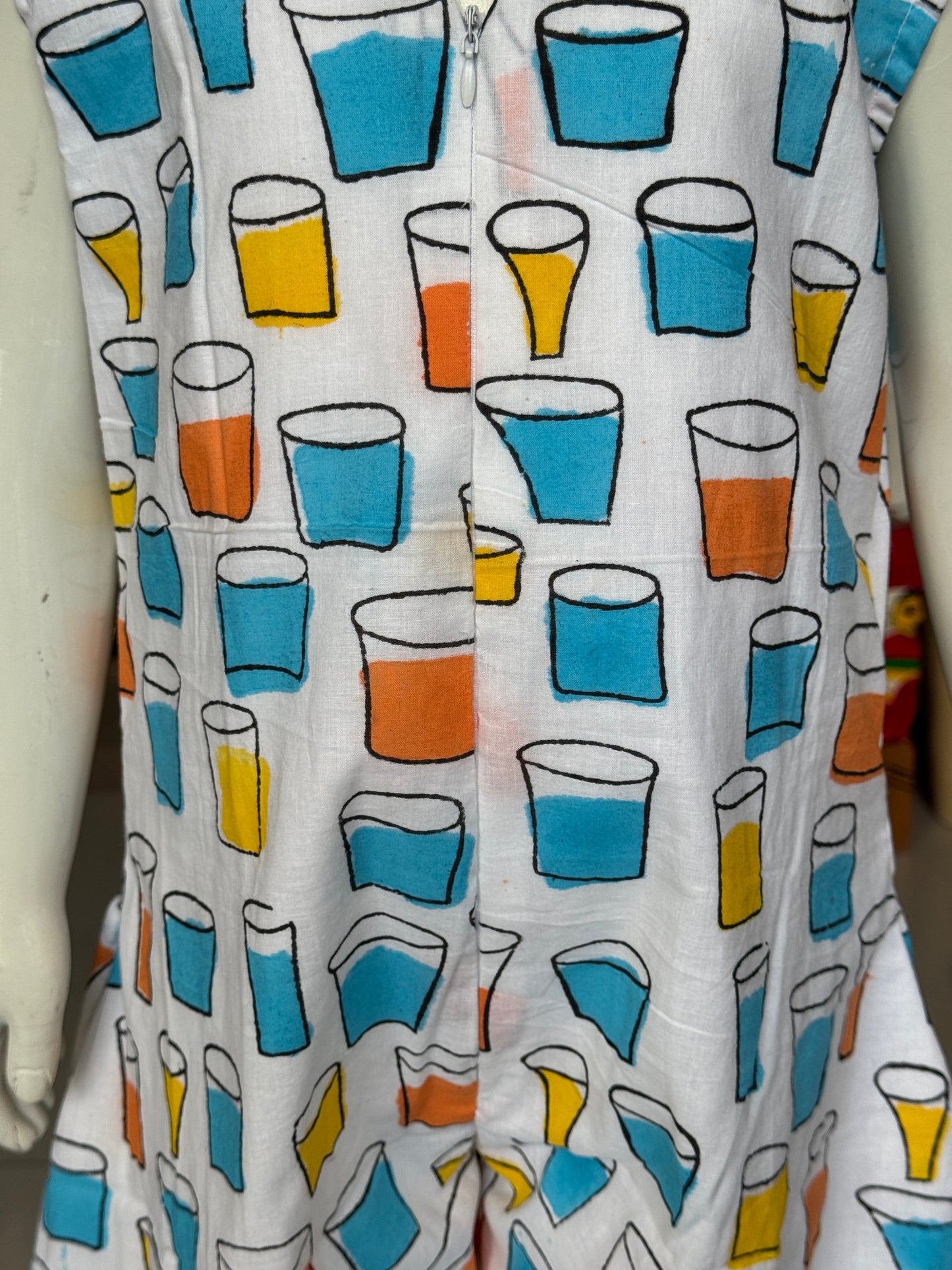 Quirky tumblers hand block printed cotton romper outfit for girls with V neck and front zipper