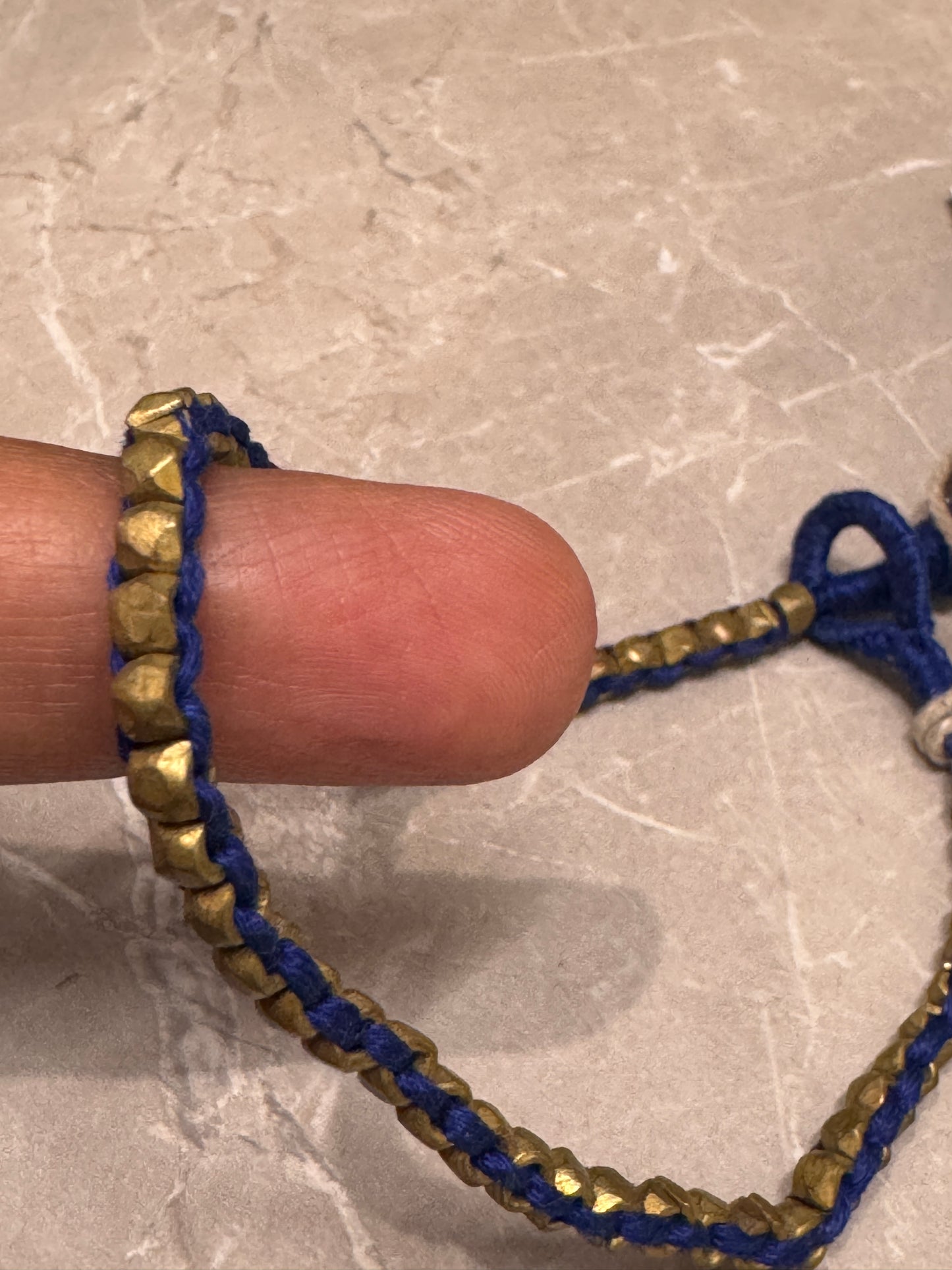 Brass dokra beads line in blue thread - anklet single