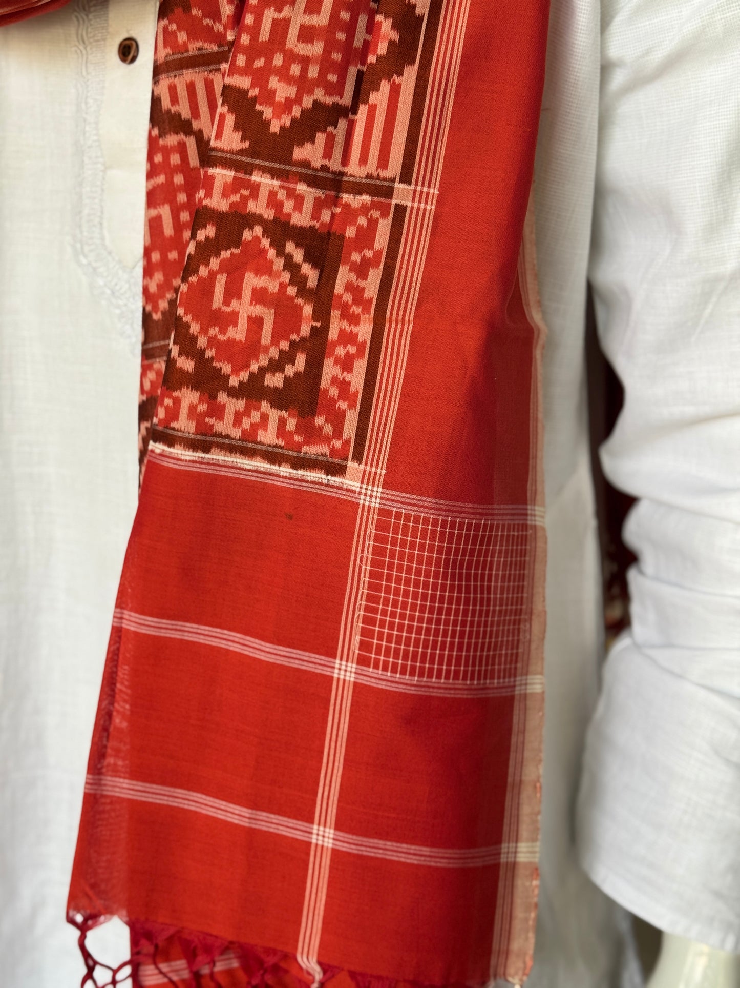 Rust tone cotton handloom soft unisex ikat stole with Swastik motifs