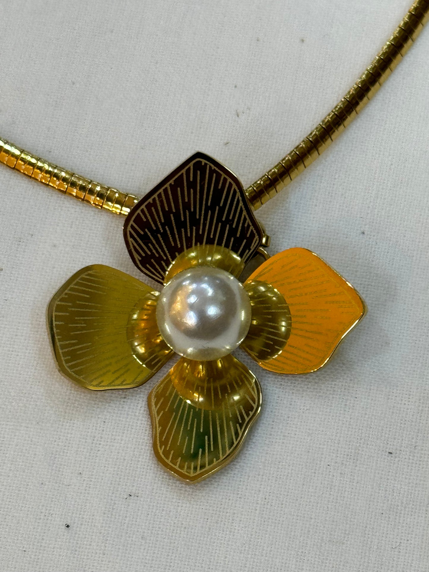 Gold tone flower pendant with pearl center neckpiece