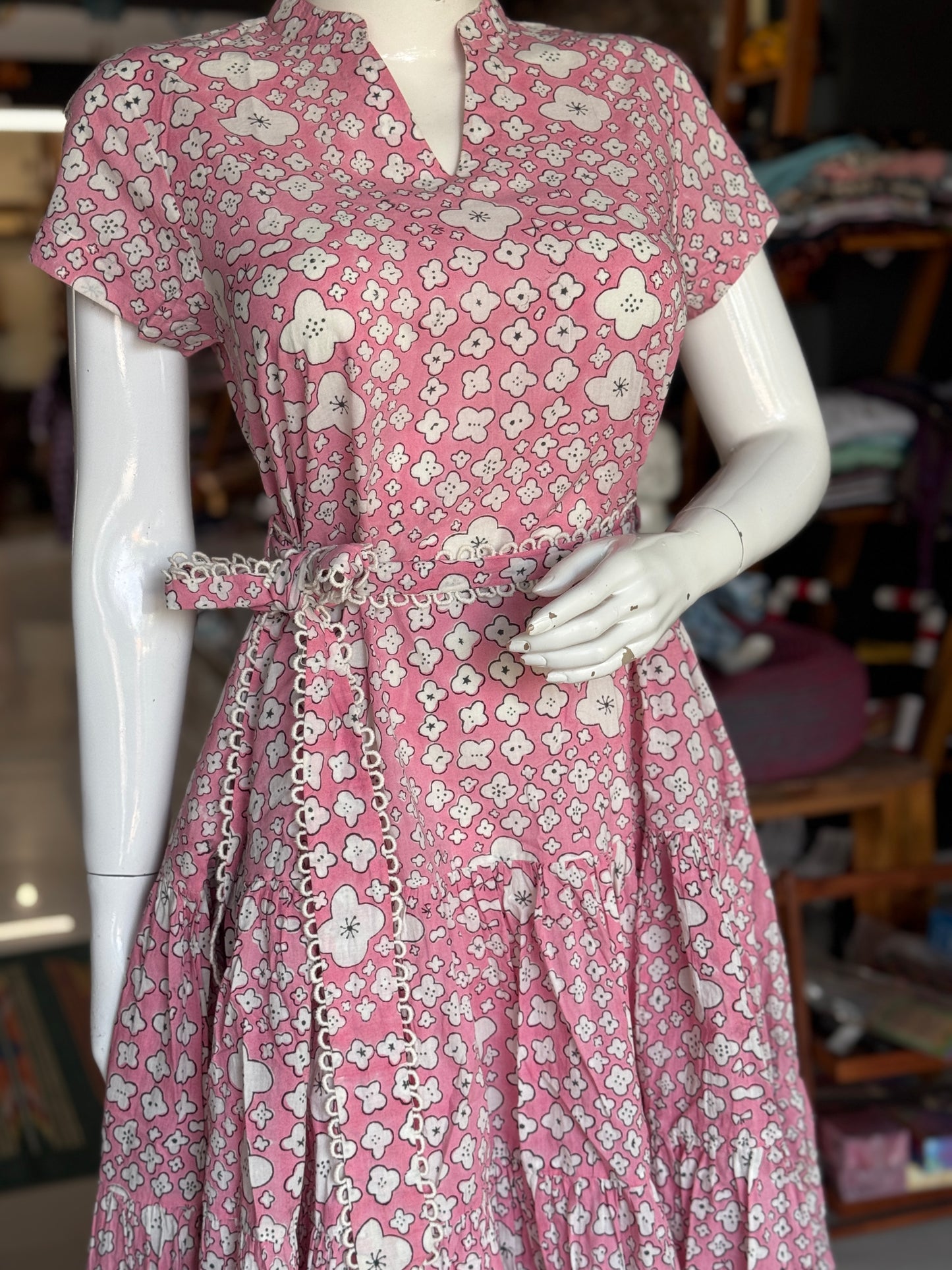 Pink cotton hand block printed tiered dress with belt and lace detailing