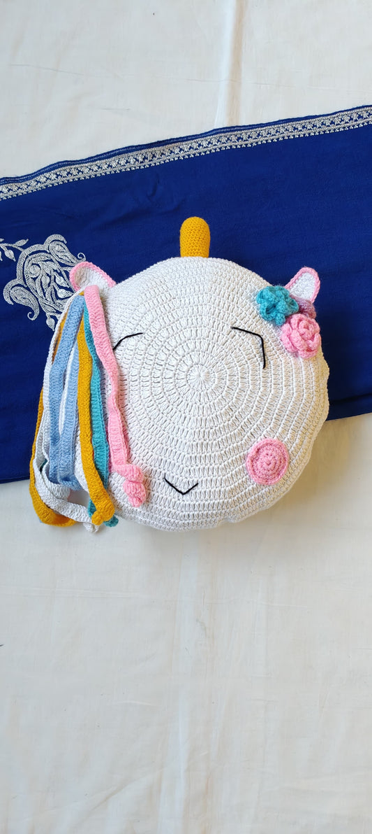 Unicorn plushie cushion in hand crochet
