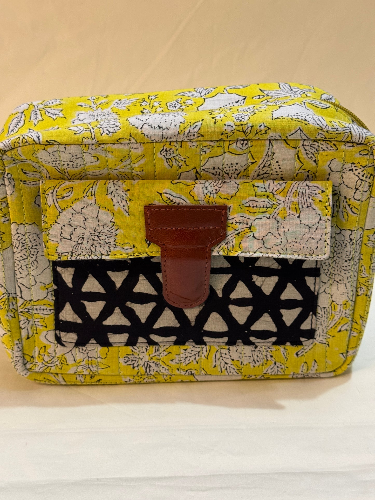 Handcrafted toiletries / travel pouch with leak proof plastic lining plus colorful front pocket with leather patch