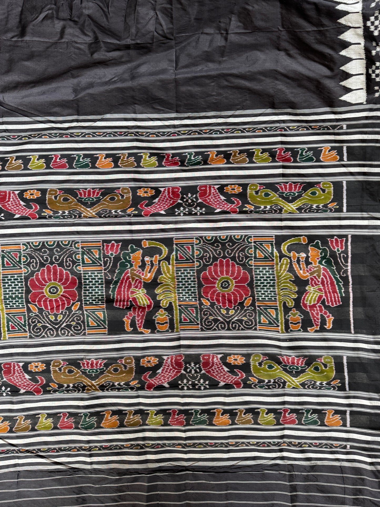 Ikat splendor - black and silver pure silk handloom saree with colorful Ikat pallu and temple border