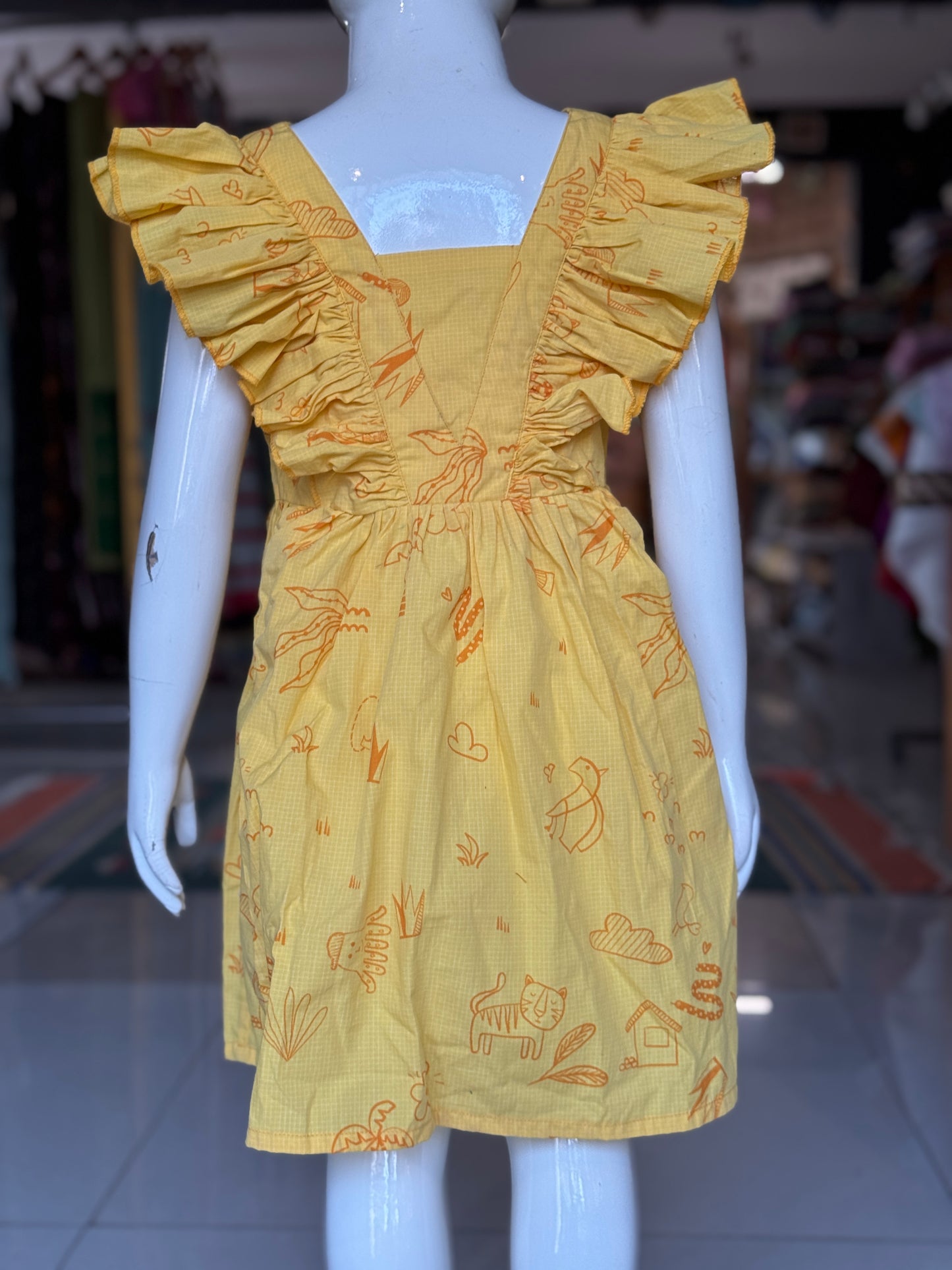 Yellow printed V-neck and flared sleeved frock for girls