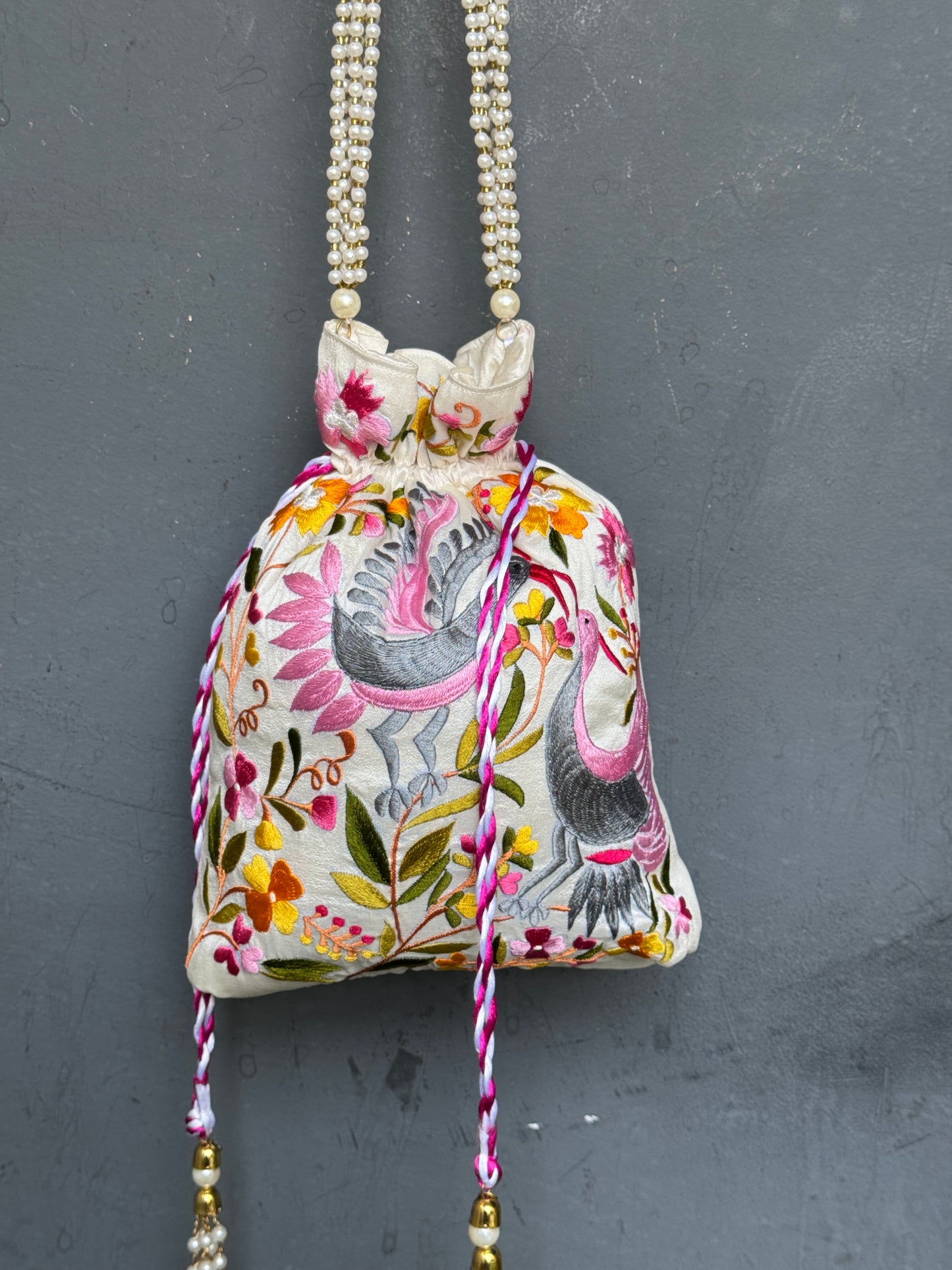 Parsi work party wear potlis with machine embroidery on art silk and pearl chain handle