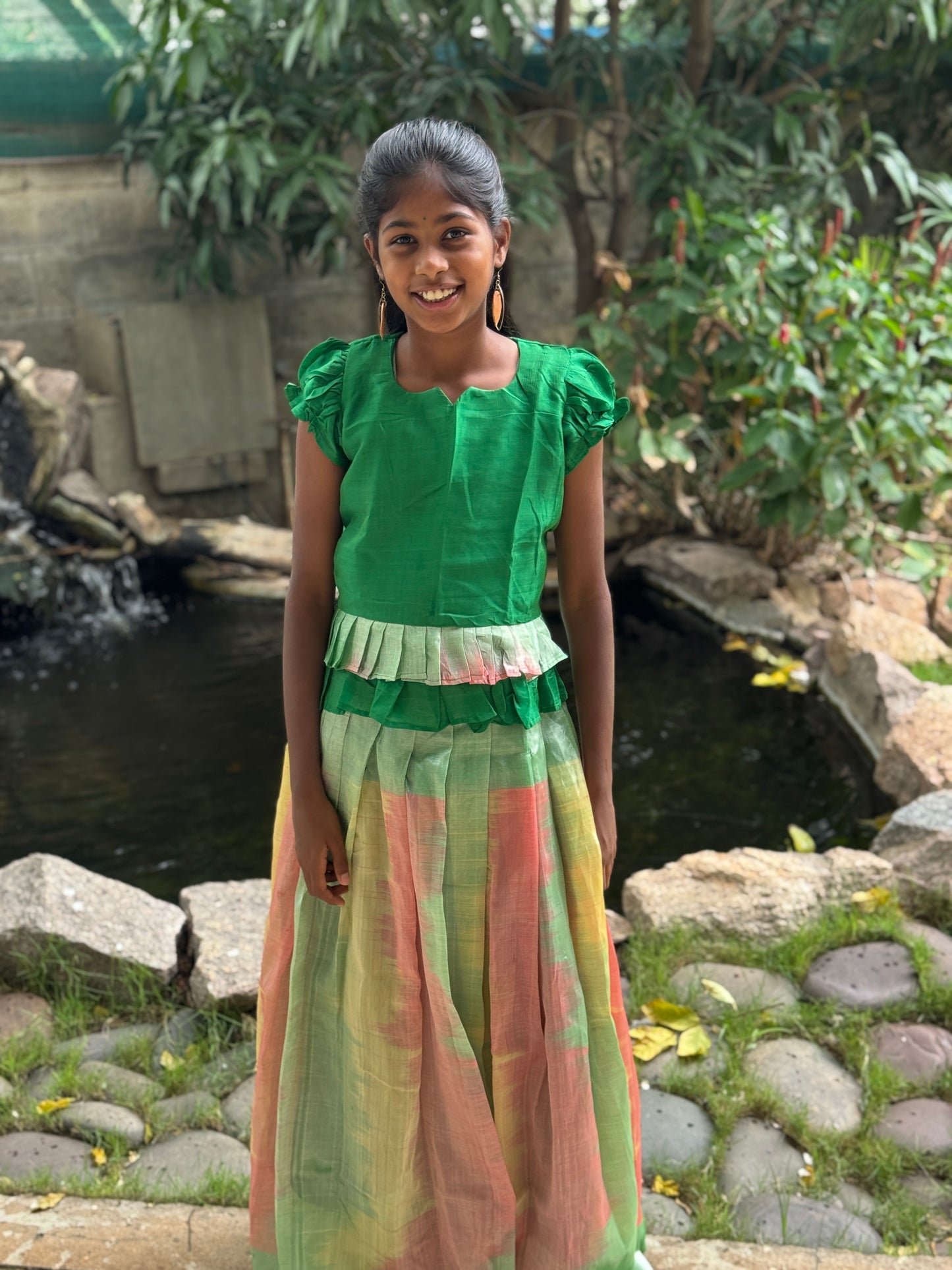 Multi color ikat handwoven silk lehenga (pattu langa) with green puff sleeves top / blouse set