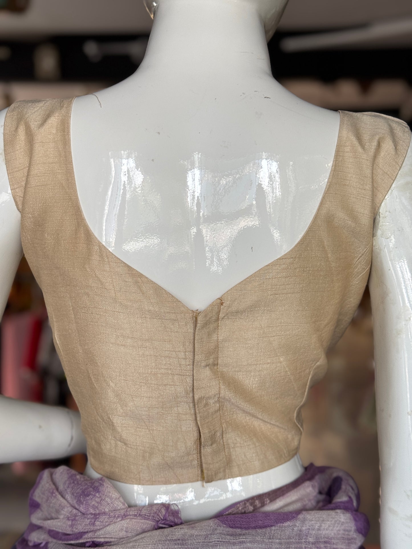 Cream plain sleeveless back open silk blouse