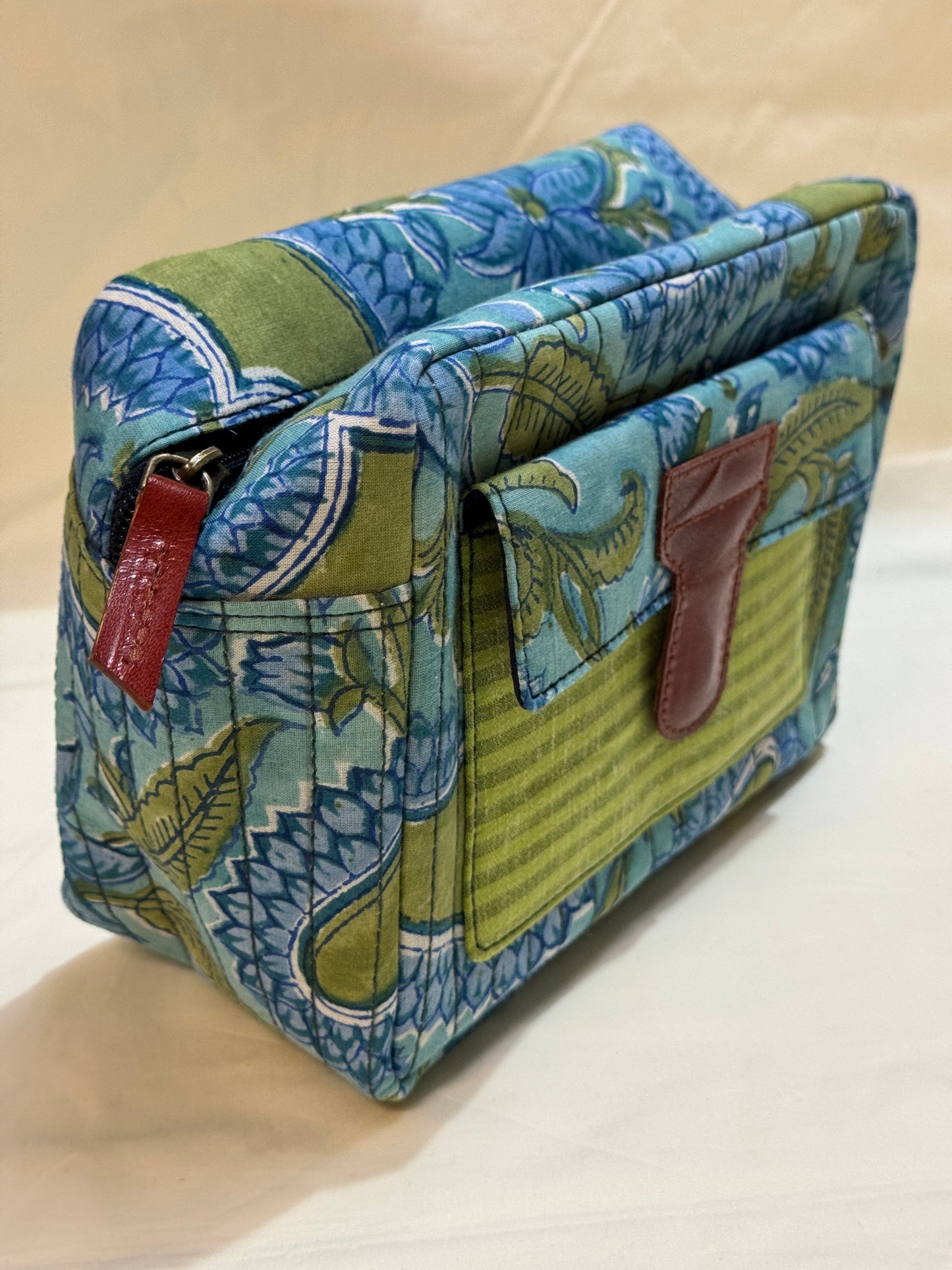 Handcrafted toiletries / travel pouch with leak proof plastic lining plus colorful front pocket with leather patch
