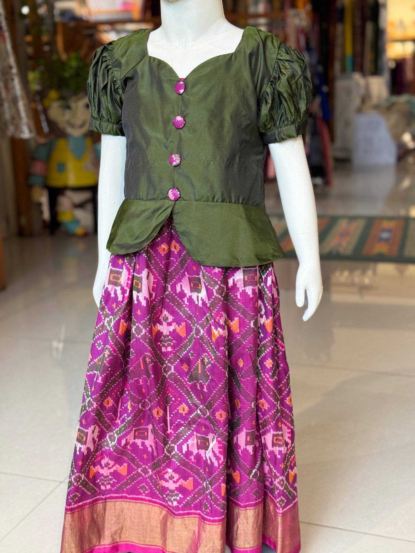 Purple handwoven ikat pure silk lehenga (pattu langa) with green puff sleeves peplum top / blouse set