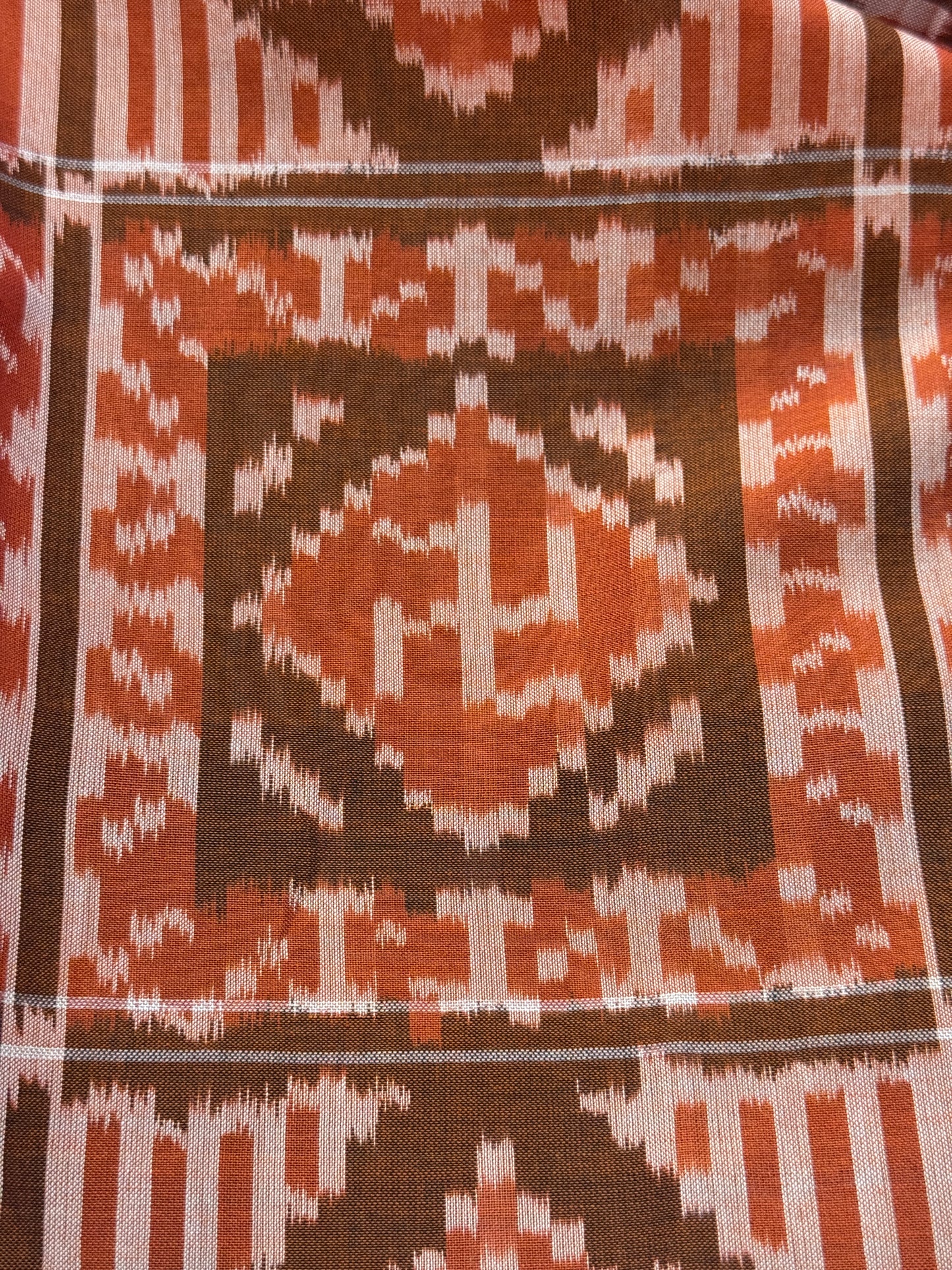 Rust tone cotton handloom soft unisex ikat stole with Swastik motifs