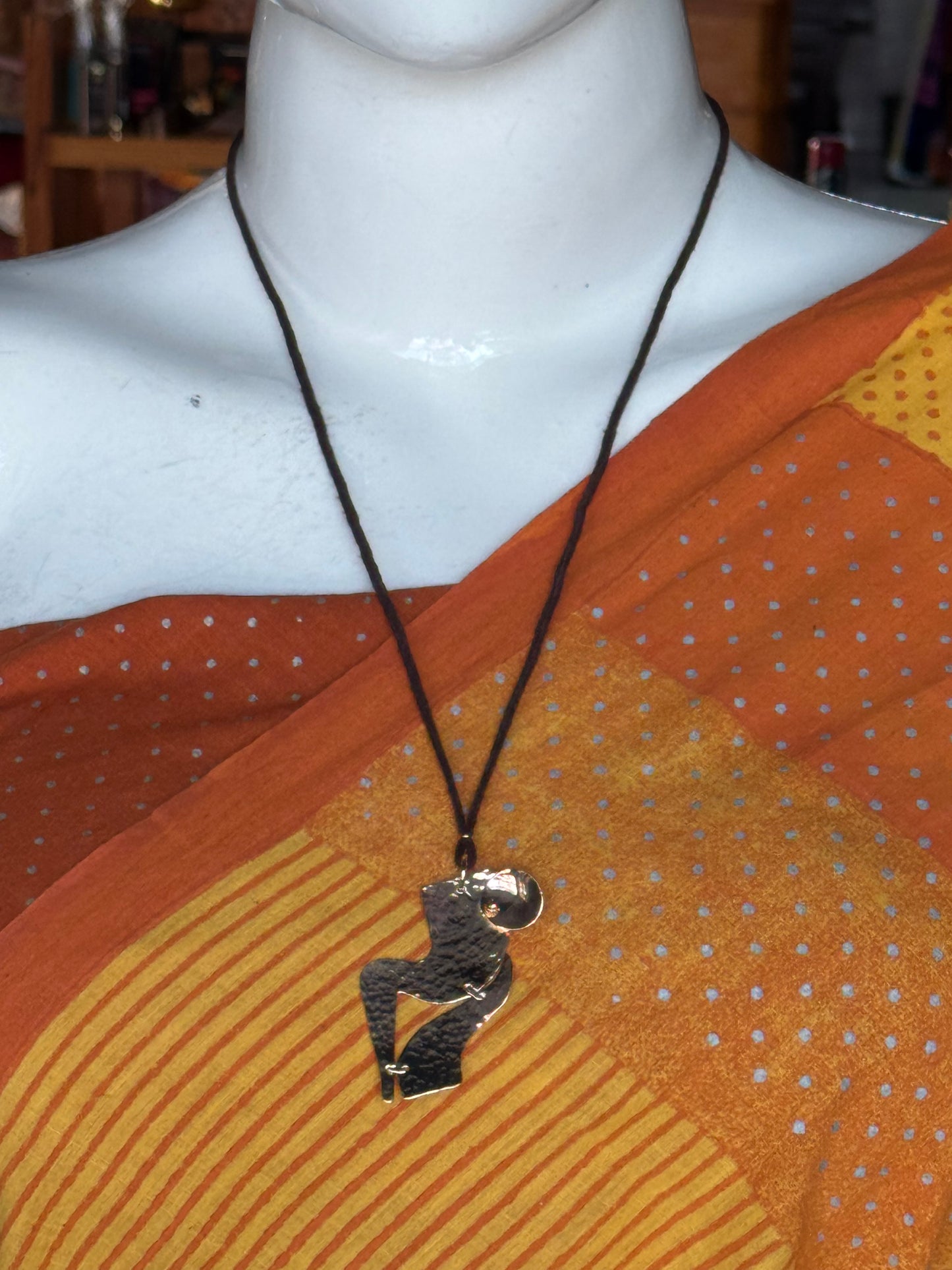 Handcrafted copper pendant with brown thread neck piece