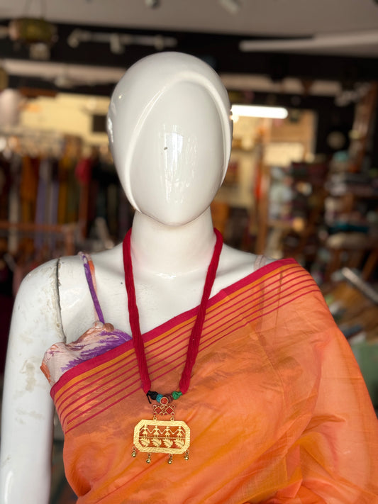 Red thread neckpiece with silver alloy metallic pendant with dancing figures