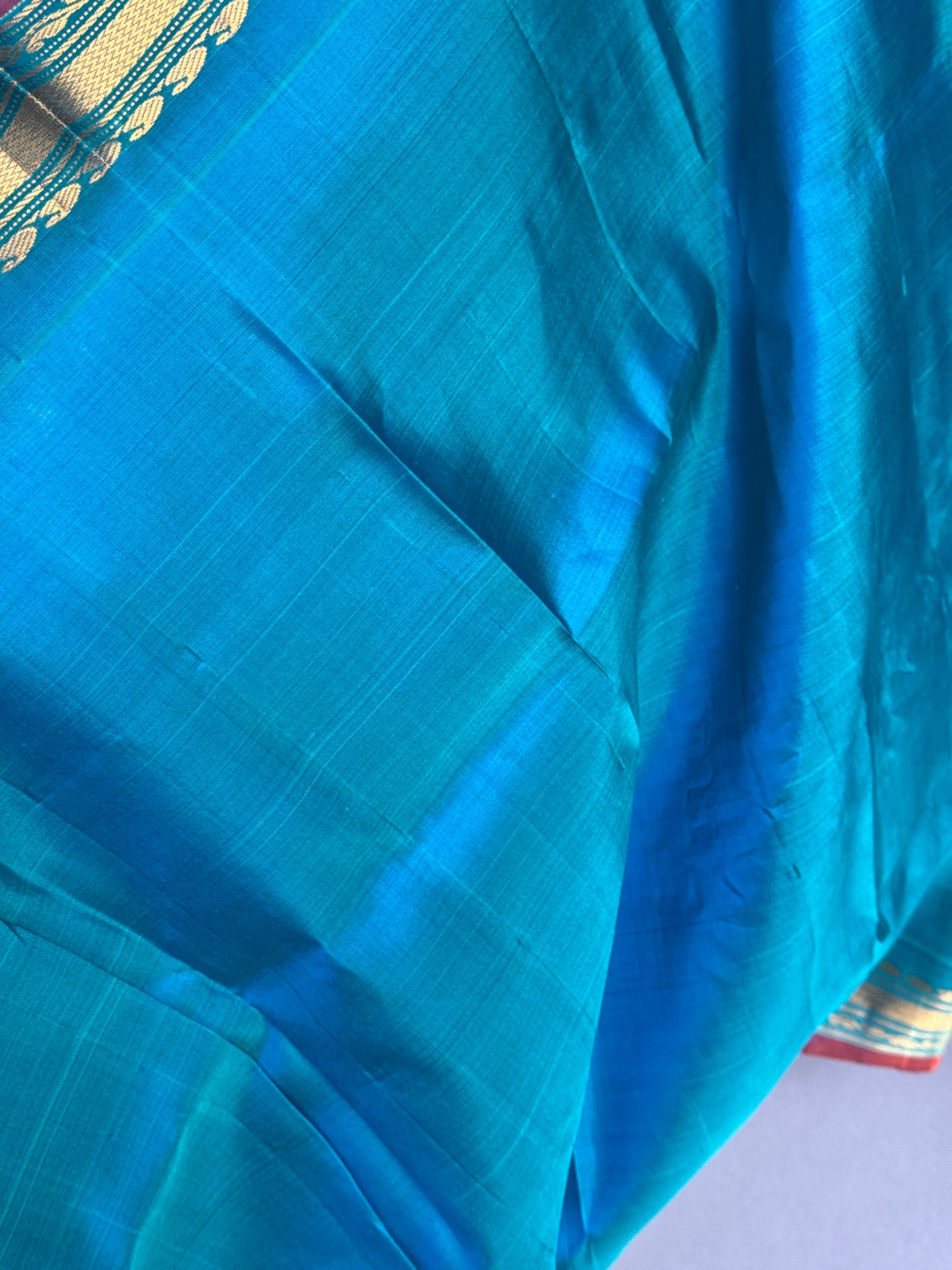 Gold spot orange and blue checks pure silk handwoven Gadwal saree with kuttu temple border