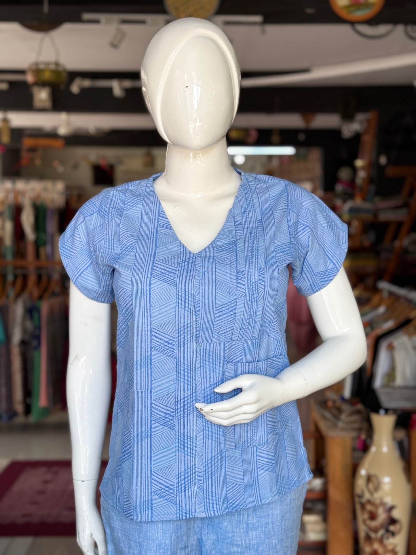 Blue geometric hand block printed cotton top with asymmetric pintucks and one side pocket