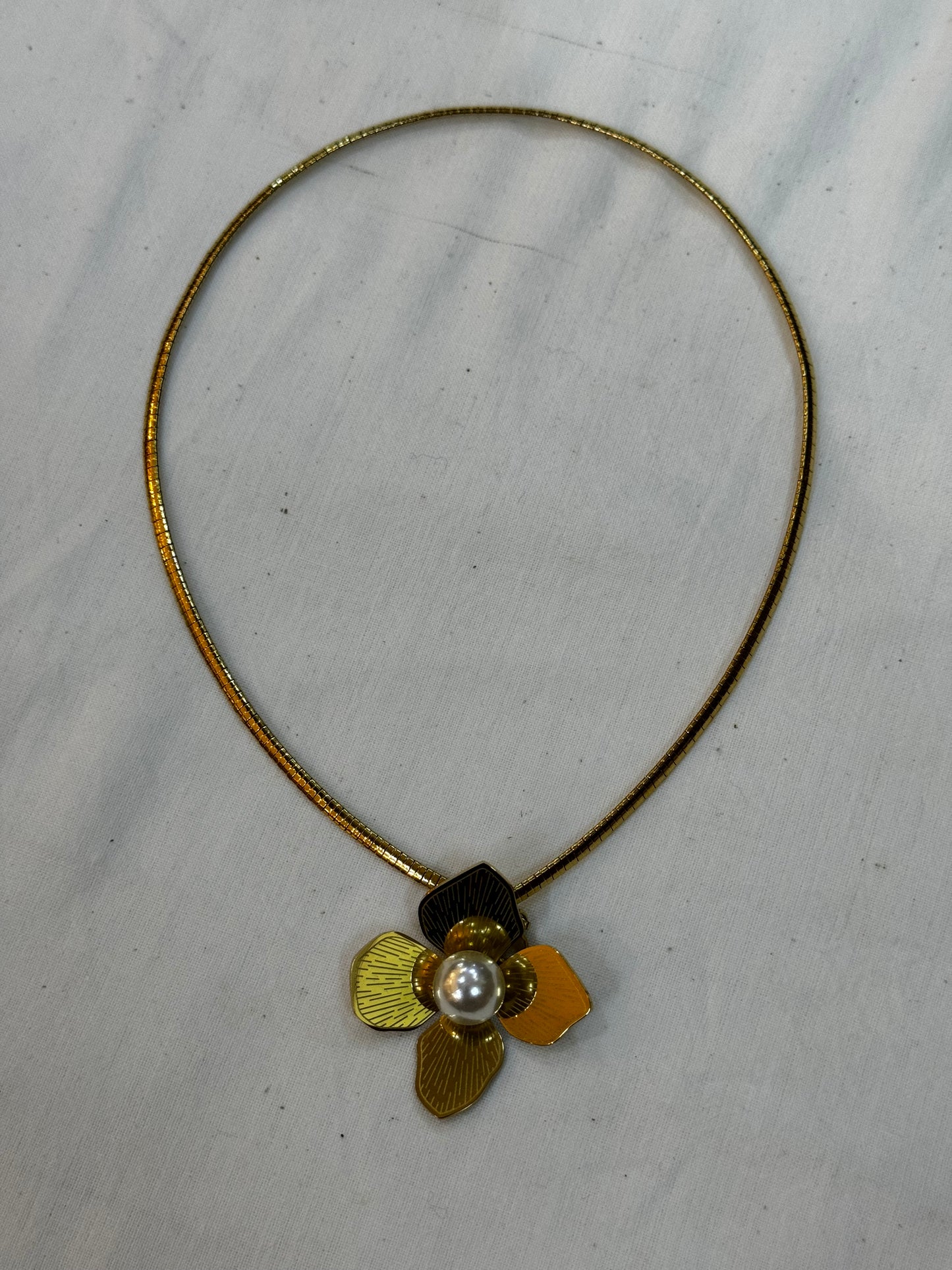 Gold tone flower pendant with pearl center neckpiece