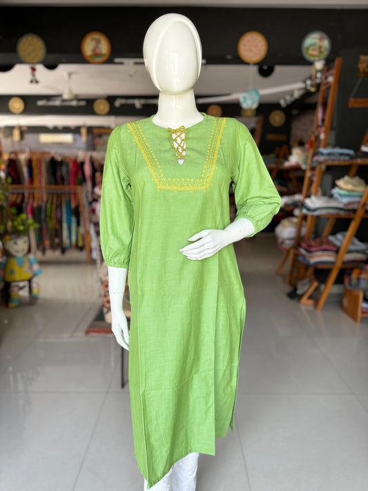 Green cotton kurti with hand embroidery on yoke and tie up dori for neck placket