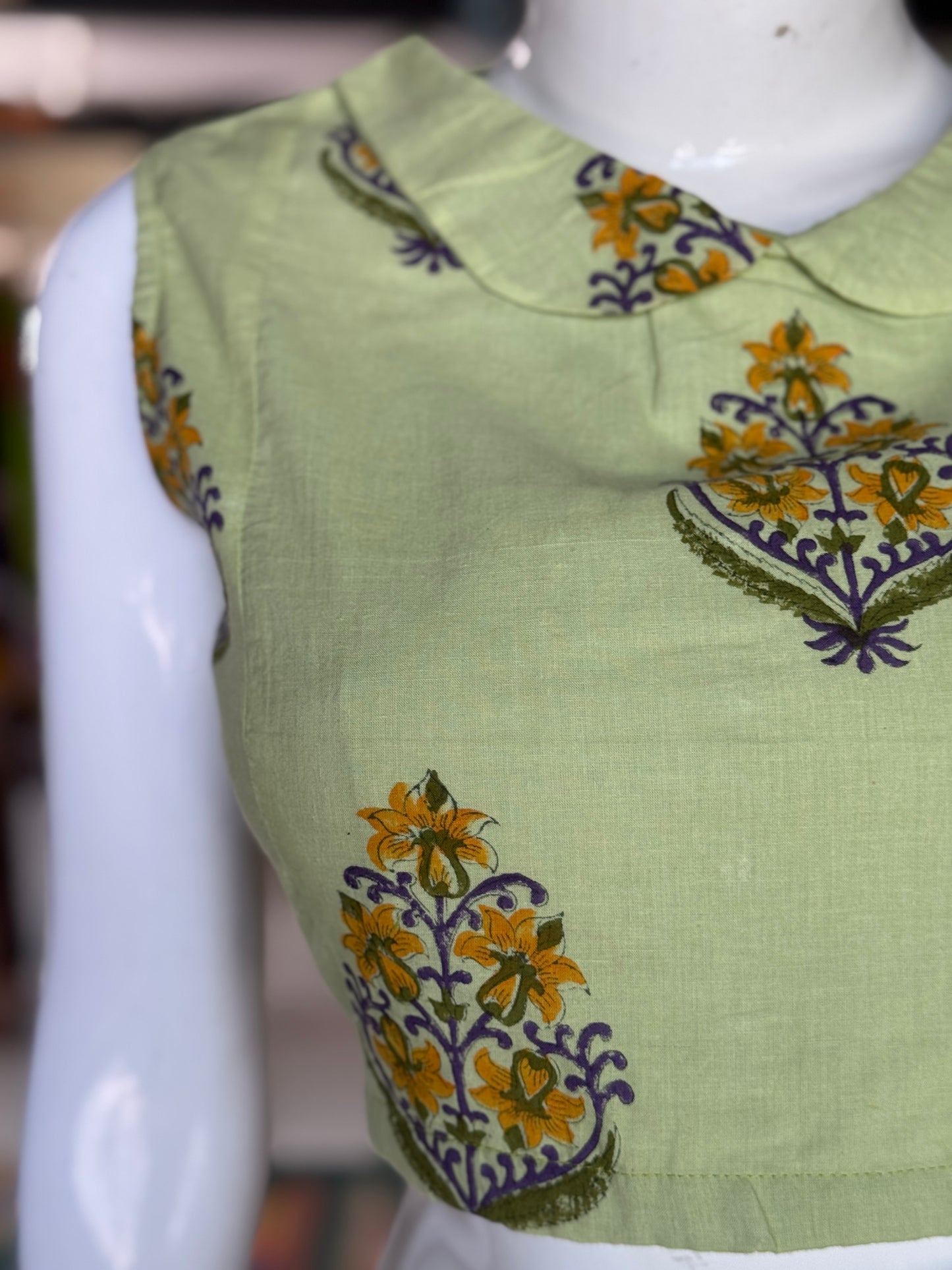 Green collared sleeveless handblock printed cotton back open blouse