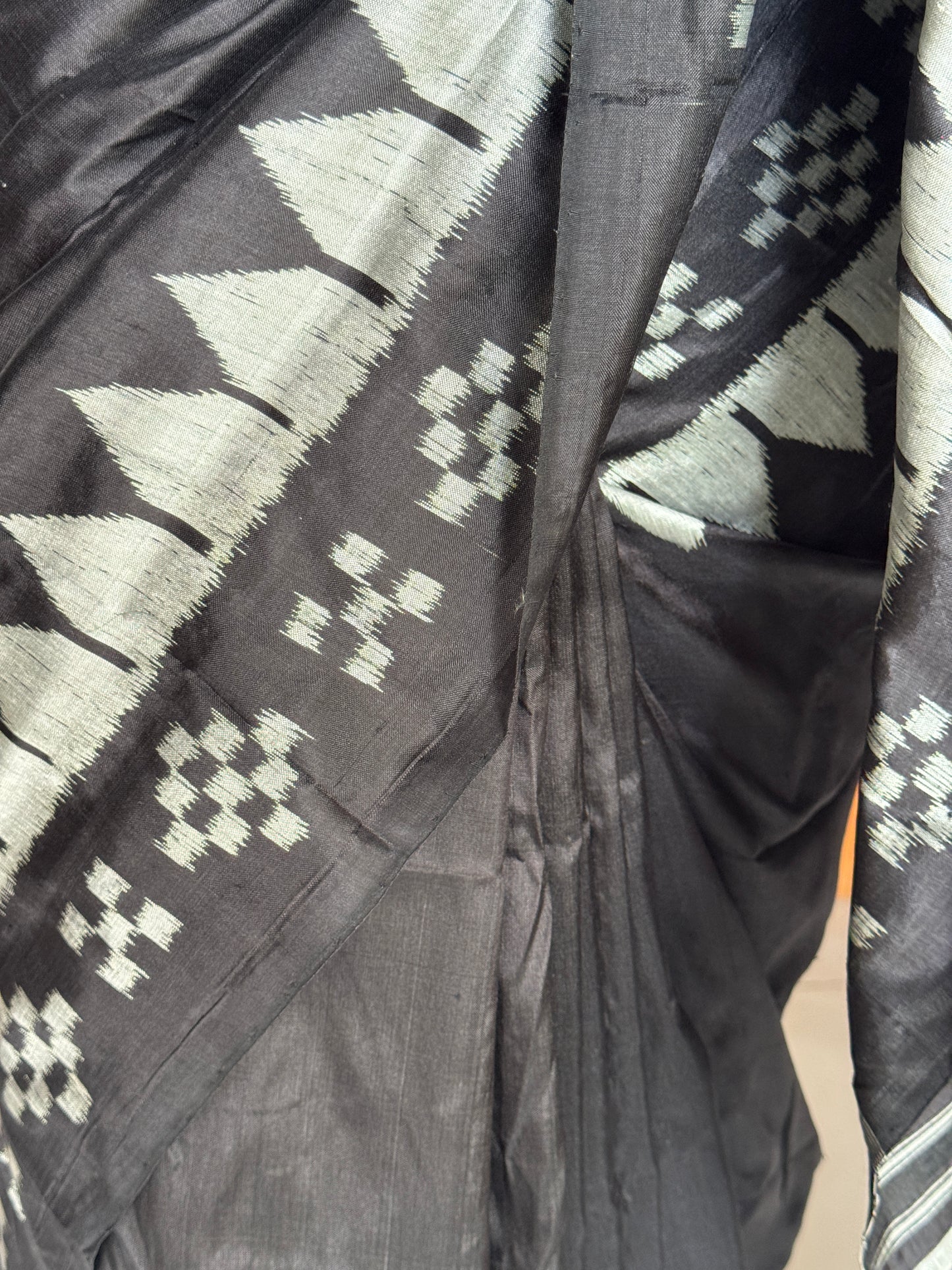 Ikat splendor - black and silver pure silk handloom saree with colorful Ikat pallu and temple border