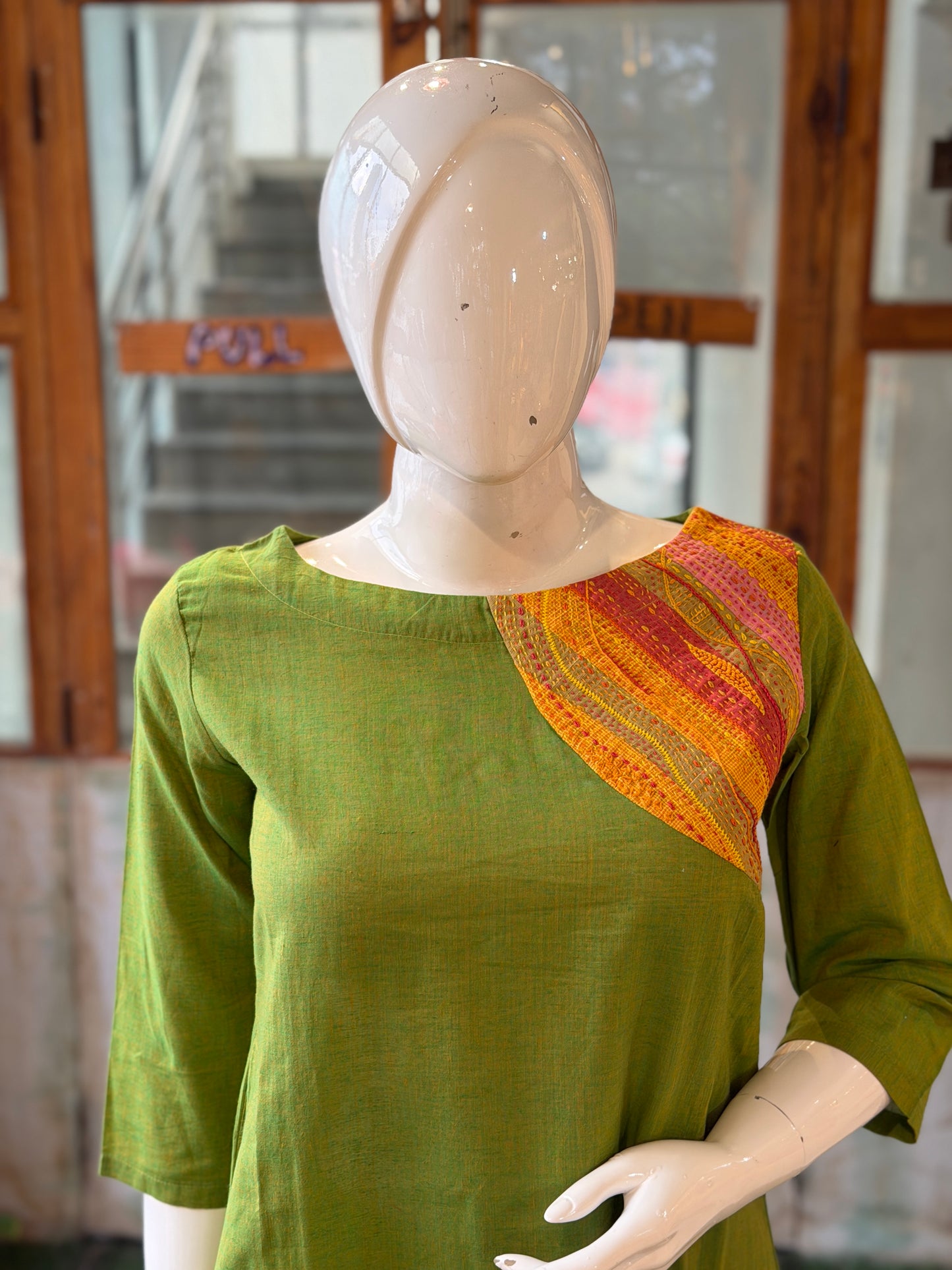 Green cotton kurti with colorful hand embroidered shoulder