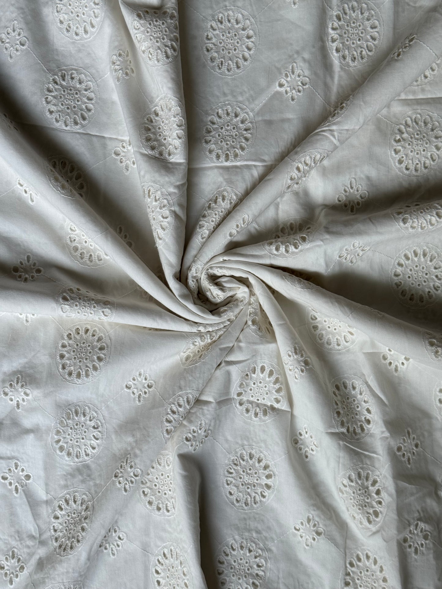 Off white schiffli cut work cotton fabric