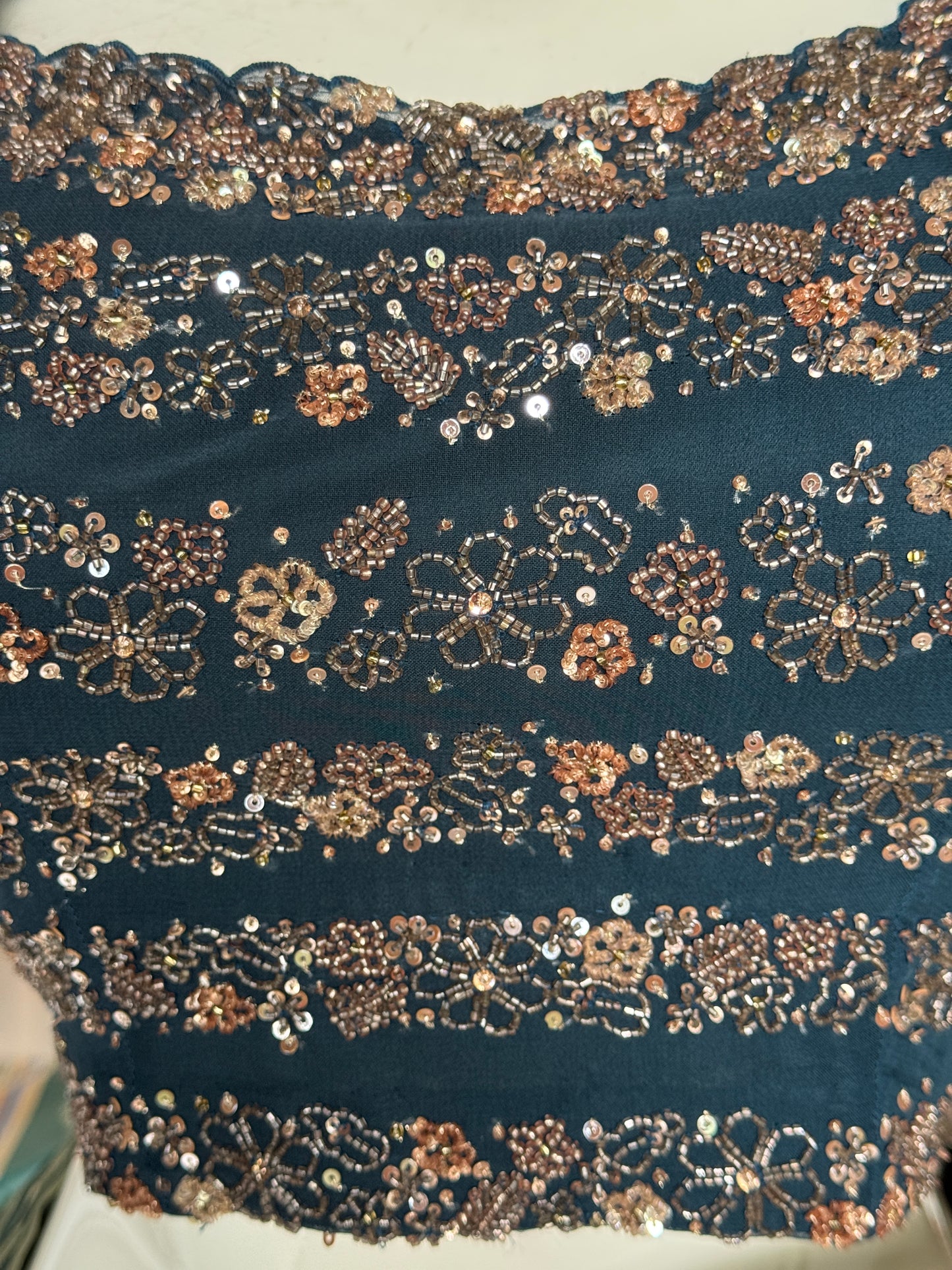 Teal hand embroidered georgette sleeveless blouse with work on front and back