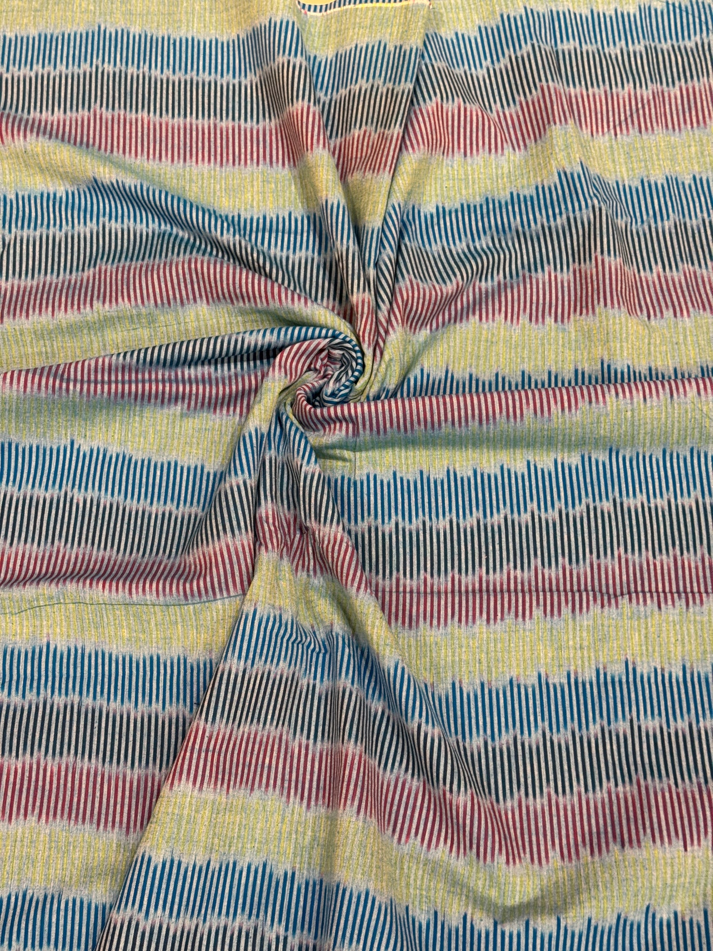 Longitudinal wave - green , blue, black, red stripes cotton handloom ikat fabric
