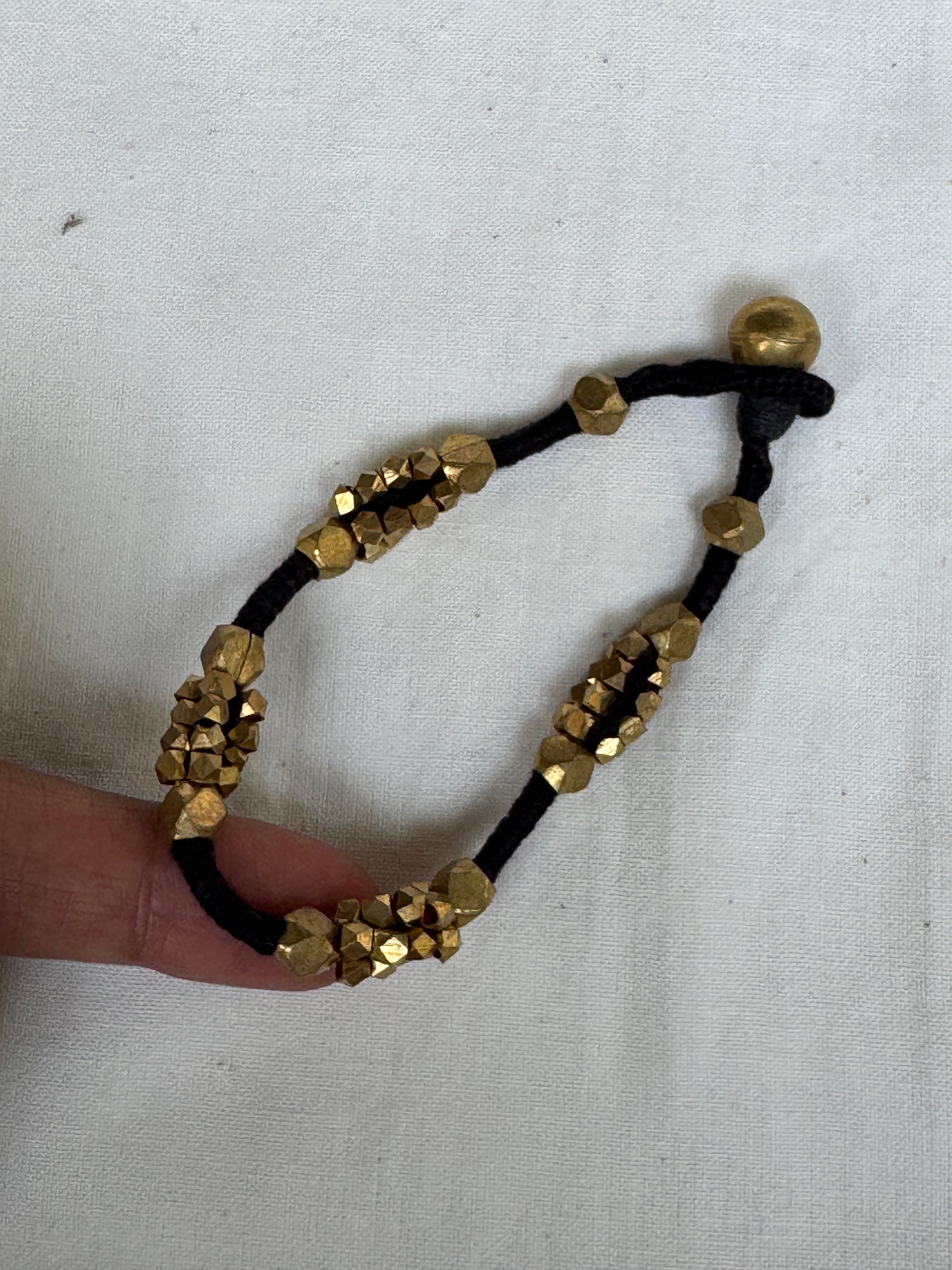 Nazariya bracelet - brass dokra handcrafted beads with black thread - single