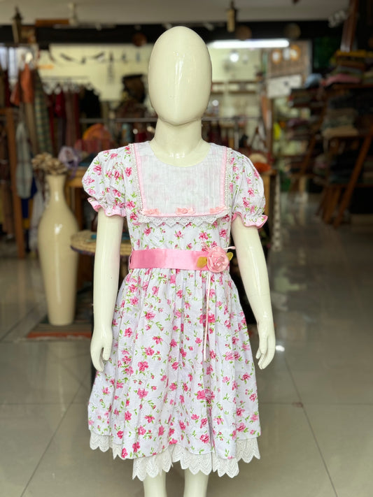 White and pink flowers print schifli cotton frock with ribbon flowers detailing at waist