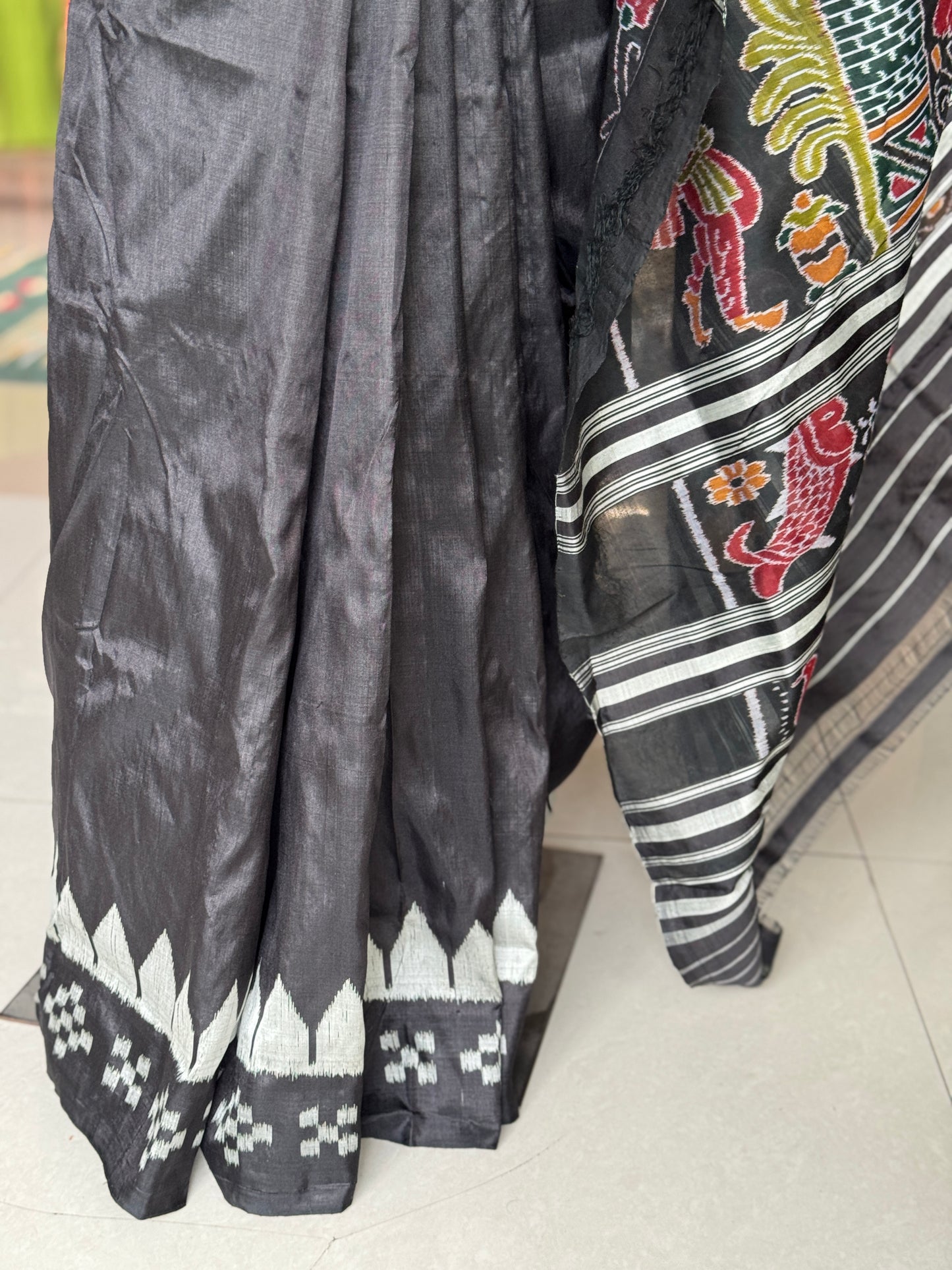 Ikat splendor - black and silver pure silk handloom saree with colorful Ikat pallu and temple border