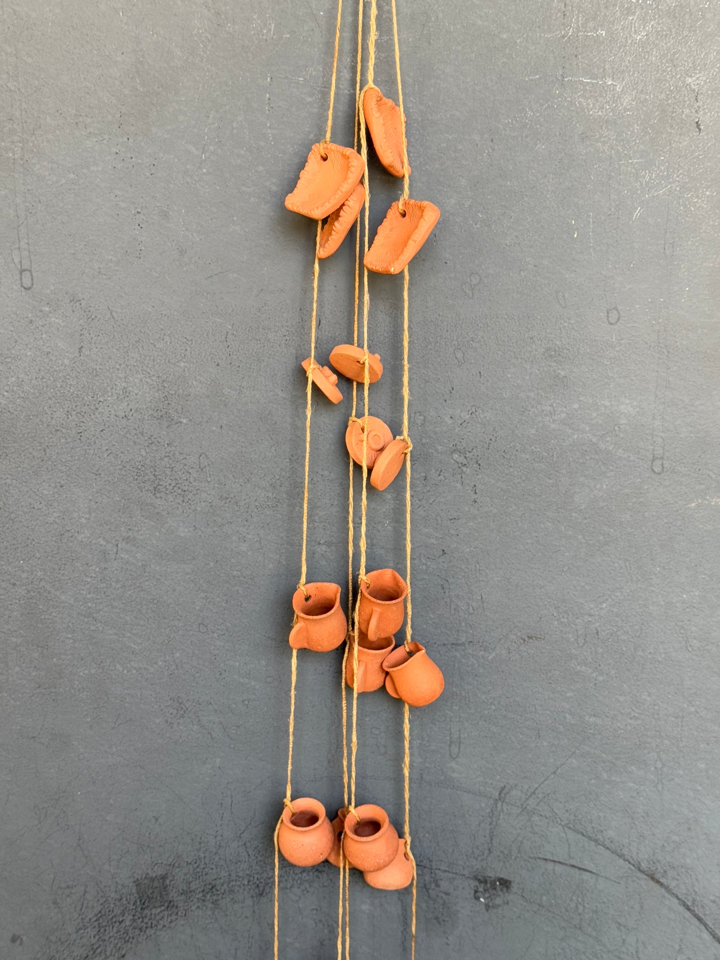 Clay hanging with 6 miniature handcrafted clay pots hung together with a thread
