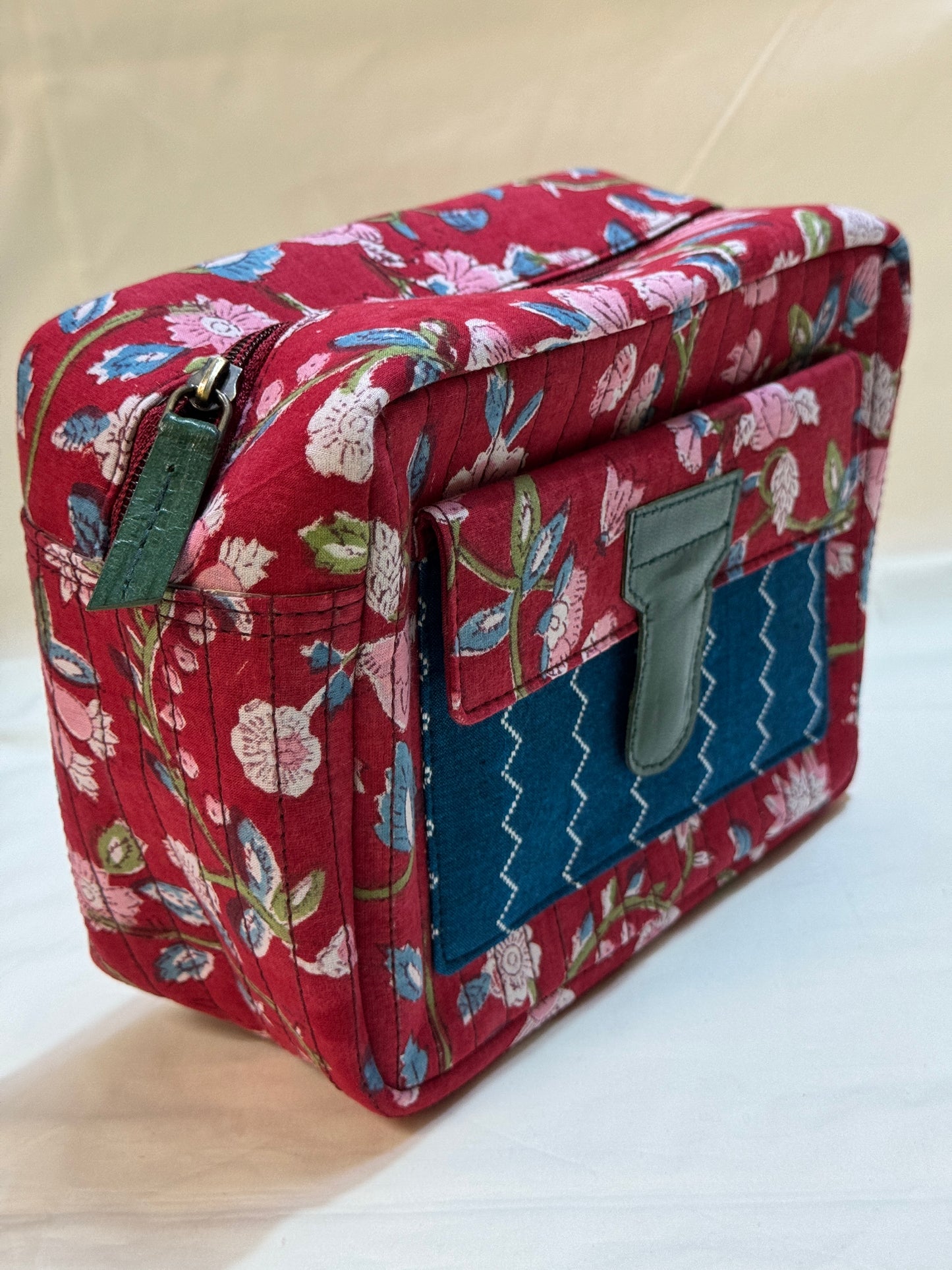 Handcrafted toiletries / travel pouch with leak proof plastic lining plus colorful front pocket with leather patch