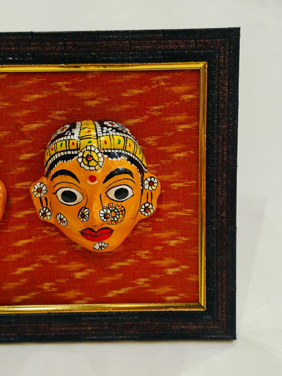Cheriyal man and woman handcrafted masks pair on ikat background wall frame