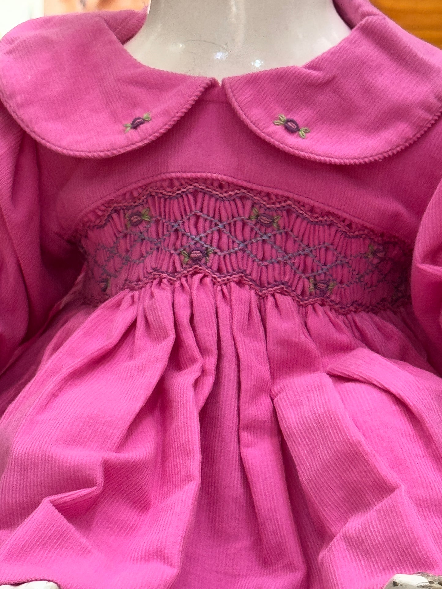 Bright pink Corduroy soft frock with peter pan collar and smocking embroidery