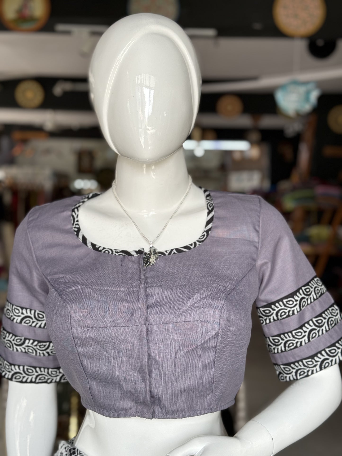 Grey cotton blouse with butterfly embroidery and black trims