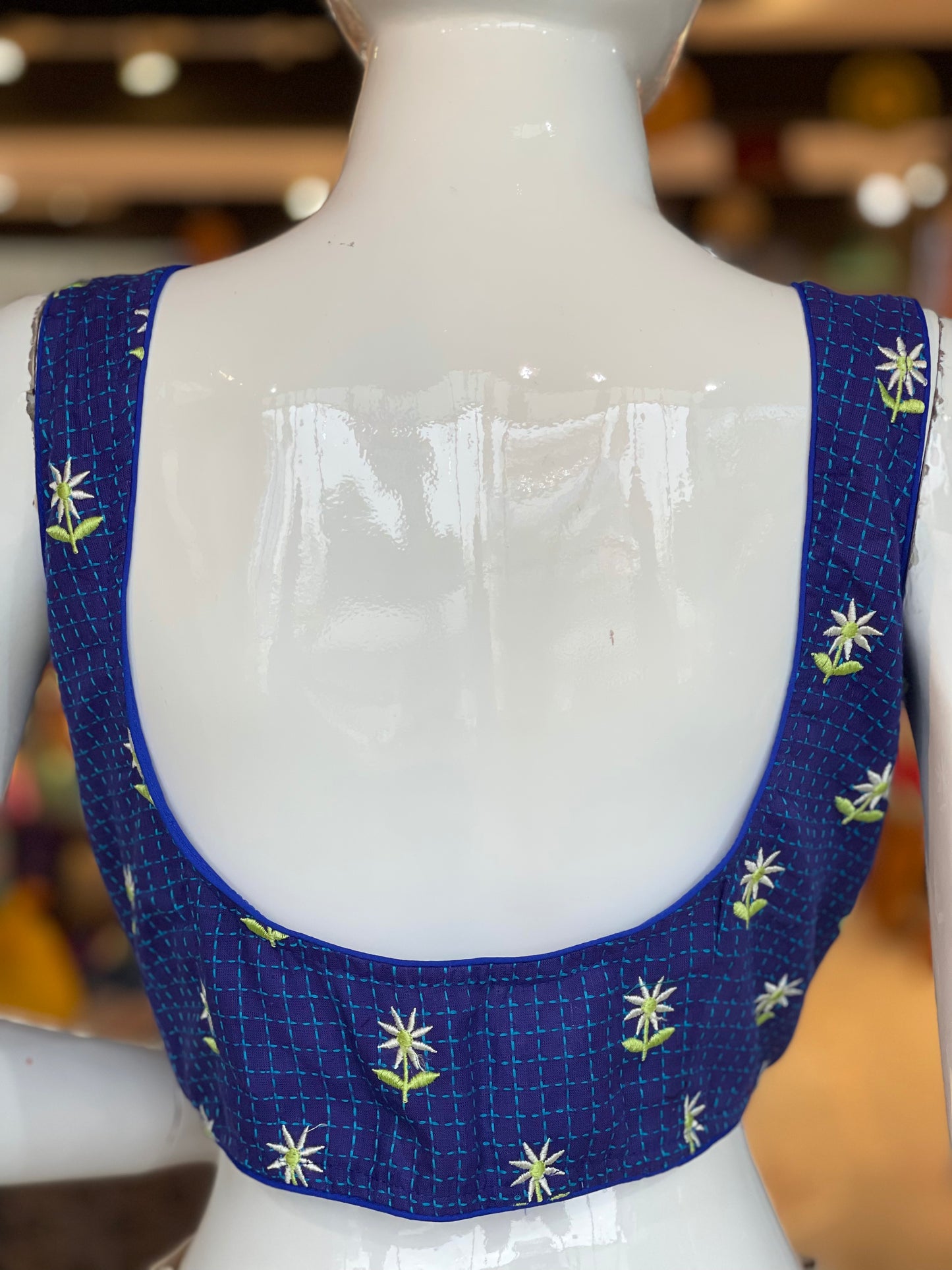 Blue checks sleeveless cotton blouse with floral embroidery