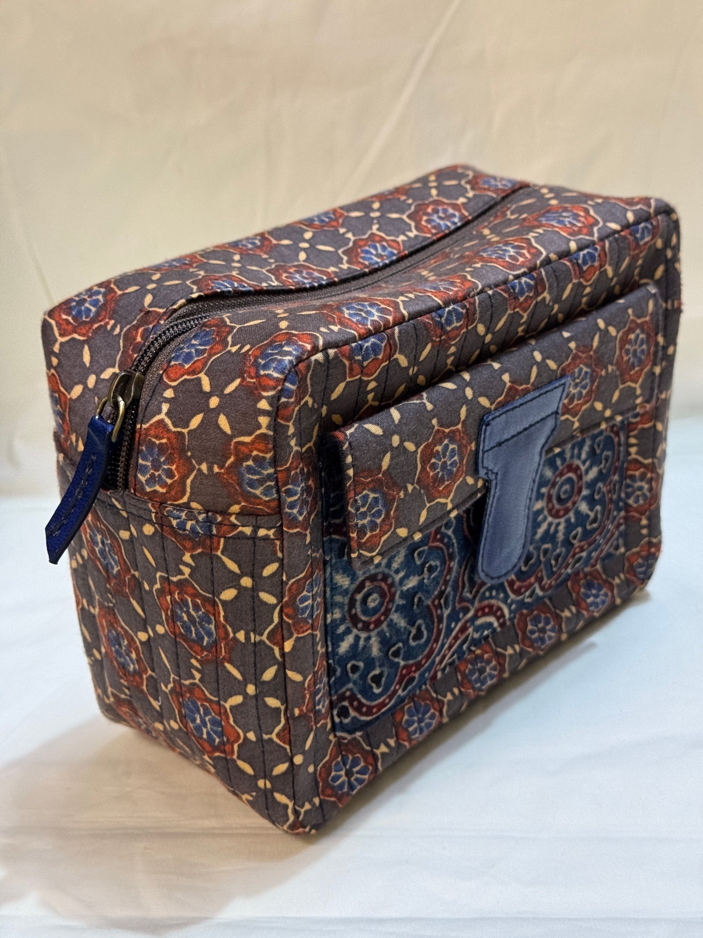 Handcrafted toiletries / travel pouch with leak proof plastic lining plus colorful front pocket with leather patch