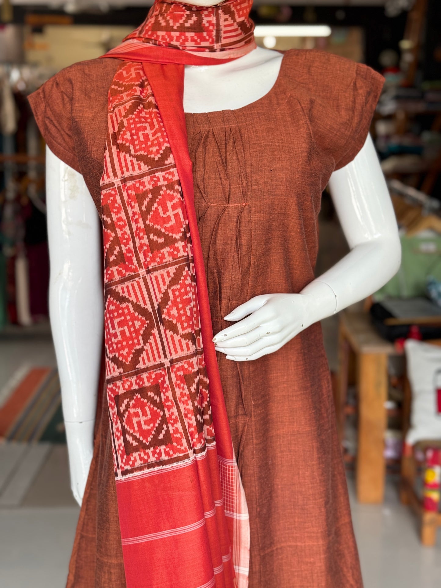 Rust tone cotton handloom soft unisex ikat stole with Swastik motifs