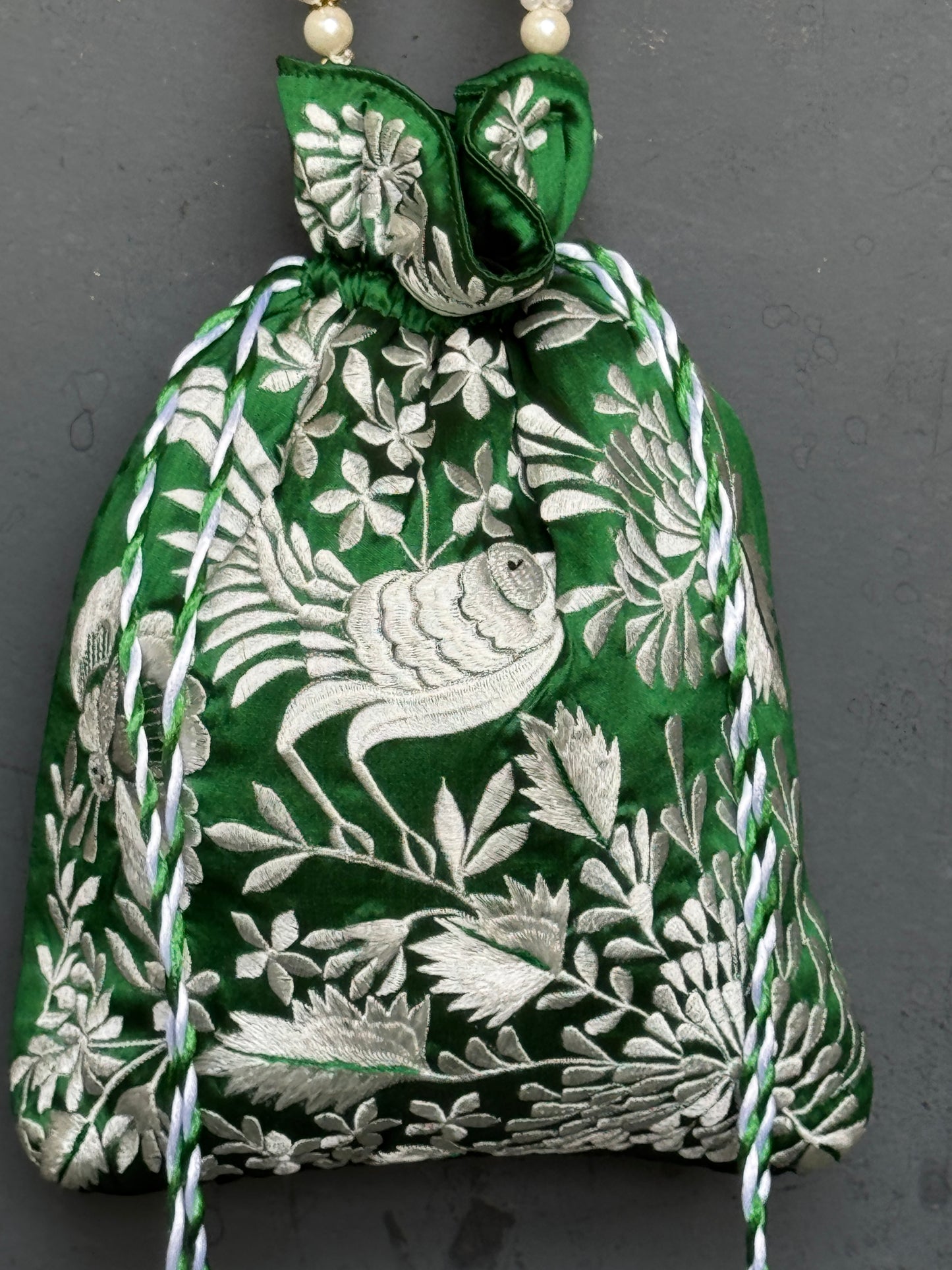 Parsi work party wear potlis with machine embroidery on art silk and pearl chain handle